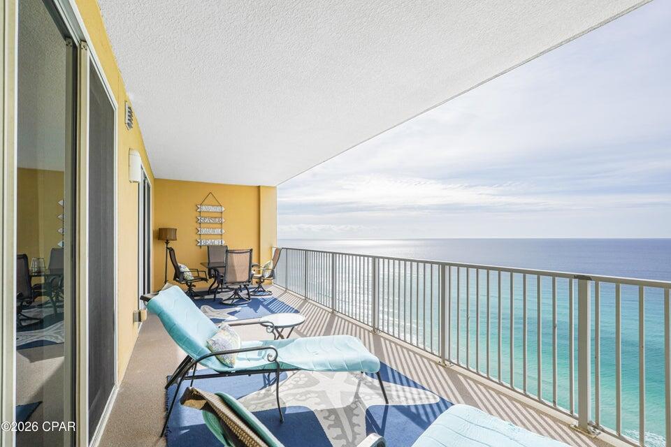 Experience the quiet side of Panama City Beach at Tropic Winds, perfectly positioned on the desirable west end of the beach. This is one of the final high-rise buildings before the secluded stretch of Bay County and into Walton County, offering expansive, uncrowded shorelines even during the height of the vacation season. Enjoy the perfect balance of seclusion and accessibility--just 2.5 miles from Pier Park, ten minutes from the upscale dining of 30A, and twenty minutes from the airport.

This two-bedroom, two-bathroom residence is in turnkey, immaculate condition. Having never been used as a rental, the home has been meticulously preserved by only two owners as a private second home. Recent updates offer peace of mind, with both the HVAC and water heater replaced in 2021.

The interior features elevated ceilings and a thoughtful floor plan that feels remarkably spacious. The kitchen is fully equipped with stainless steel appliances, a breakfast bar and a kitchen sink with a beach view! Ceramic tile flooring throughout the main living areas and extra-thick, premium carpet (installed 2019) in like-new condition in the bedrooms. The dedicated walk-in laundry room is a rarity in a condo, and has been stylishly updated with a custom barn door, cabinetry, and high-end front-loading washer and dryer.

The master suite serves as a private retreat, featuring black-out curtains for restful mornings and a private en-suite bathroom with a custom-tiled walk-in shower. Step directly from the master bedroom onto the massive 10' x 28' balcony, an expansive outdoor living space perfect for dining while overlooking the emerald waters. The guest bedroom is equally impressive, large enough to accommodate a triple bunk plus a full-size bed, with easy access to an updated full bathroom with a walk-in tiled shower.

Tropic Winds enhances your coastal lifestyle with an indoor/outdoor beachfront pool, hot tub, sauna and steam room, fitness center, and even a dedicated dog park. For the buyer seeking a move-in or rental ready property that combines modern reliability with high-end finishes, this residence is ready for you!