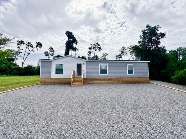 Welcome home to this brand new 3 bedrm, 2 bathrm manufactured home, offering modern style, thoughtful design & an unbeatable location just minutes from everything you need! Situated on 0.26 acres, this beautiful home features an inviting open-concept floor plan w/ abundant natural light, recessed lighting & ceiling fans in every room for year round comfort. The spacious kitchen is designed for both everyday living & entertaining, boasting stainless steel appliances, a large center island, ample cabinetry & a walk-in pantry. The private primary suite offers a spa-inspired retreat w/ a luxurious walk-in shower, soaking tub, dual vanity sinks, private toilet closet & generous storage. Outside is the open rear deck, perfect for grilling, relaxing, or enjoying peaceful evenings overlooking your backyard. Ideally located for both recreation & convenience! Less than ¼ mile from the Fanning Bayou boat ramp - perfect for the boating & fishing enthusiasts. Just 1.5 miles from the new Southport Sports Complex. Approximately 4 miles from Lynn Haven, offering shopping, dining, medical facilities & the new Publix.
Only 30 minutes to the beautiful white-sand beaches of Panama City Beach. Zoned for highly rated Southport Elementary & excellent local schools.Whether you're searching for your 1st home, a peaceful retreat, or a low-maintenance property close to both the water & city conveniences, this move-in-ready home offers the perfect blend of comfort, style & location! $5K seller credit w/ a full price offer!!