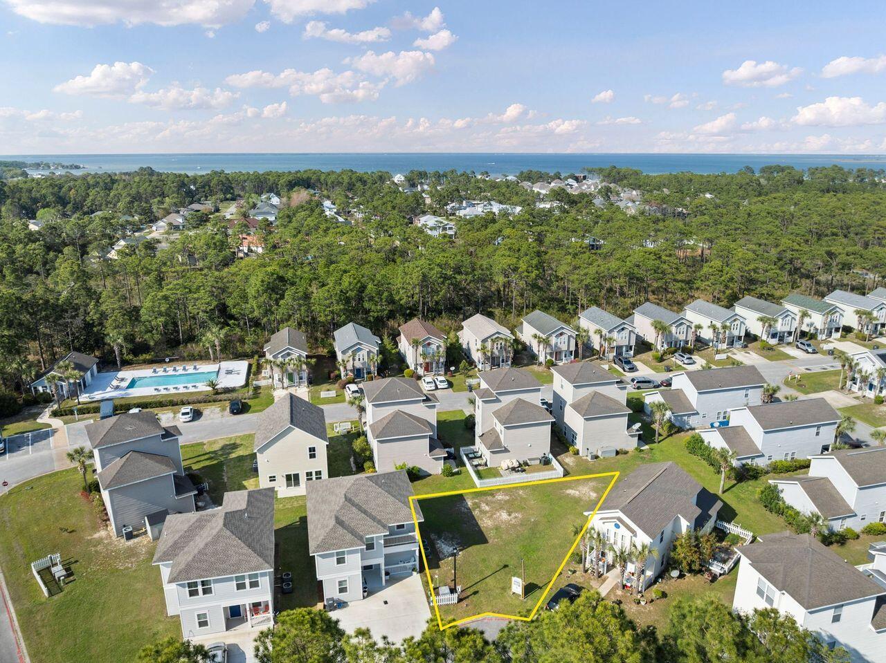 Best priced buildable lot in Flood Zone X in Santa Rosa Beach, perfectly positioned within the established Enchanted Estates Community on a quiet cul-de-sac. This homesite offers added privacy & minimal traffic, perfect for enjoying a peaceful, laid-back lifestyle. Tucked within a welcoming neighborhood, enjoy access to a gated community pool complete with a charming pool house, all bordered by preserved state forest to the north providing a serene, natural backdrop.

This lot purchase includes HOA-approved house plans, offering a streamlined path to building your ideal home with confidence and ease when timing is right. From this prime location, you're just minutes from the sugar-white sands & emerald waters of Walton County's renowned beaches, as well as the scenic beauty and outdoor adventures along 30A and nearby Topsail Hill Preserve State Park. To the west, enjoy dining, shopping, and entertainment at Grand Boulevard, Sandestin Resort, and Silver Sands Premium Outlets. Everyday conveniences are close by, including Publix, Van R. Butler Elementary School, and Ascension Sacred Heart Hospital.

Whether you're envisioning a full-time residence or a relaxing getaway, this property places you right in the heart of it all.
