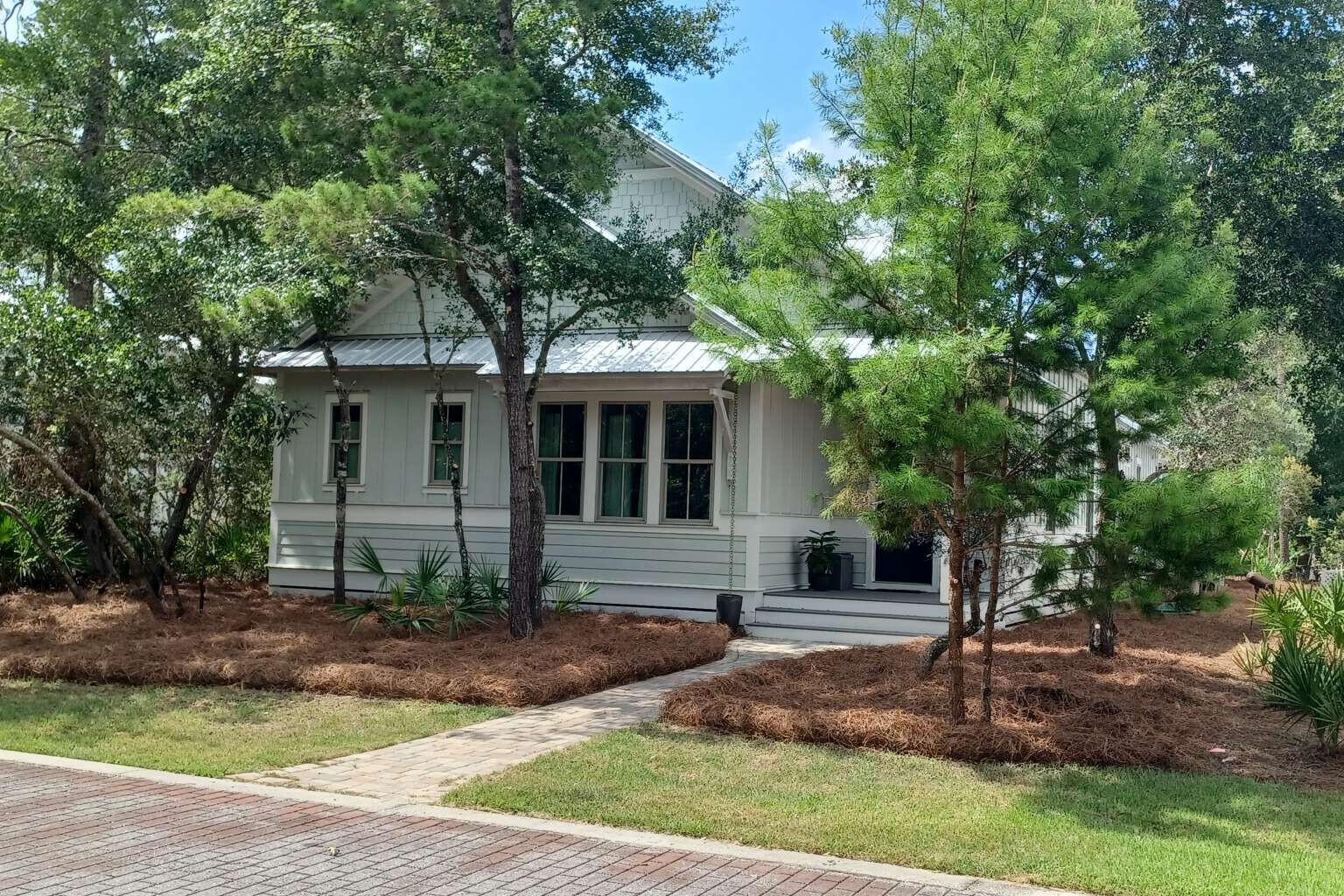 Located in the Point Washington Road community with access to all the outdoor activities that South Walton has to offer, 117 Devlieg Avenue is ideal as either a primary home or vacation home! The spacious single-story floorplan with 10-foot ceilings features 4 bedrooms, an office, separate living and kitchen spaces, and a central exterior porch, as well as a full 3-car garage. As you enter the home, step into a dedicated foyer area that opens up to both the office space with front-yard view and the large main living space with 12-foot ceilings and custom trim accents. A secondary bedroom with en-suite bath is located to the front of the home. Two additional guest bedrooms with a shared bathroom are located centrally. The separate kitchen features ample storage and counter space, and GE Profile appliances meaning that there is always room for cooking a fine meal. The private master bedroom at the rear of the layout features a wood-plank tray ceiling, and a gorgeous private bathroom with walk-in closet. The central porch can be accessed from the dining space. There is parking space for 3 full-size vehicles in the detached garage, and three more can fit in the driveway. For boaters and kayakers access to the Choctawhatchee Bay is located just one block away via a hidden-gem public boat-launch into McQuage Bayou. If you prefer walking or riding to the Bay, the nearest public access is less than a half-mile down the street. And for hikers, Point Washington State Forest runs the length of Point Washington Road, just a block South. With a central porch, a stand of old-growth in the front yard, and HOA-maintained greenspace directly across the street, the home provides nature and seclusion--even in the midst of a vibrant neighborhood with conveniently-located community pool and nearby to dining and shops. With a mix of private comfort inside and immediate access to a variety of natural wonders outside, this beautiful custom home is uniquely situated to provide everything you are looking for.