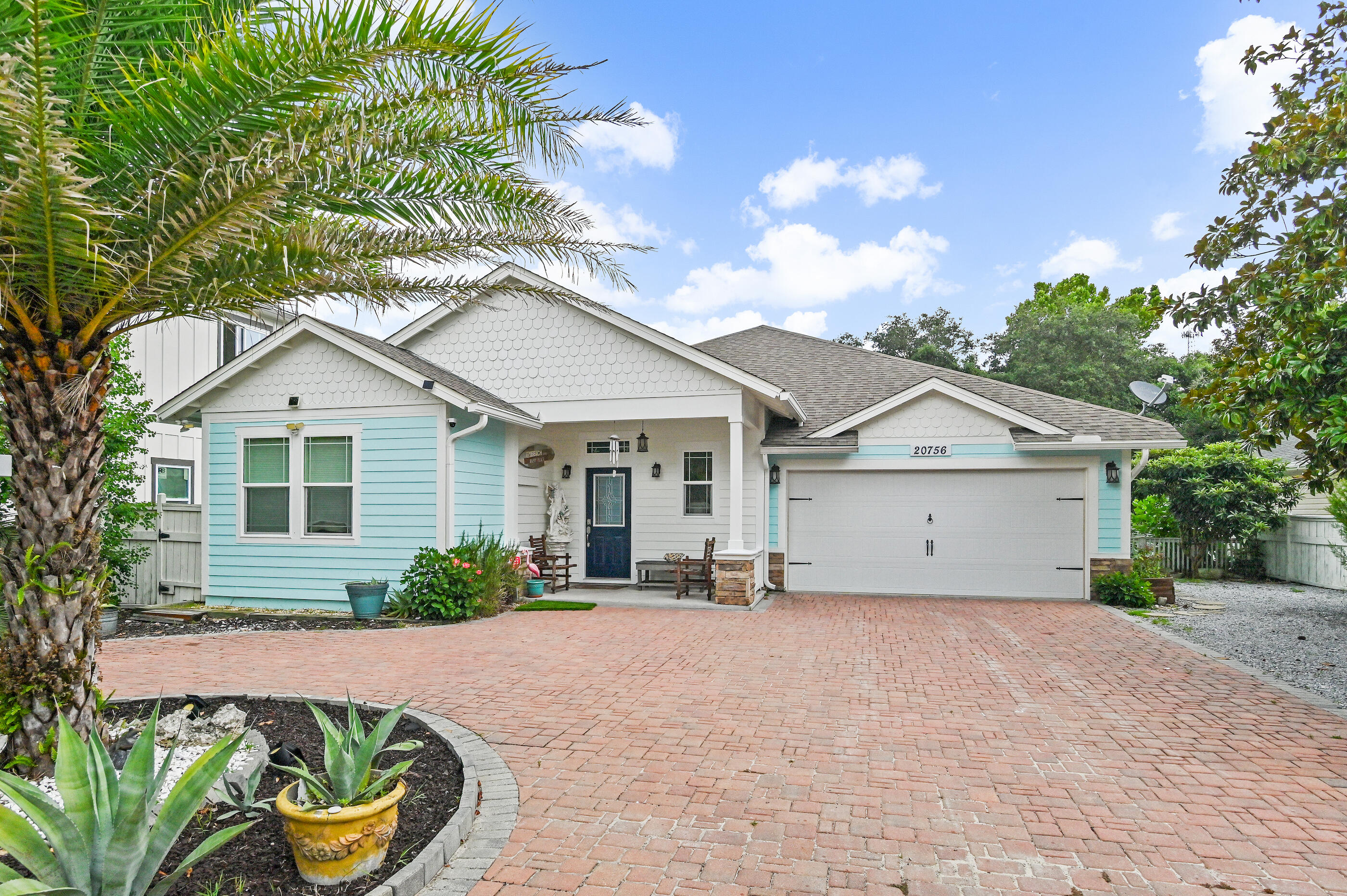Experience the best of beach living in this custom-built Laguna Beach retreat. 

Located just a short walk from the sugar-white sands and emerald waters of the Gulf, this custom-built 3-bedroom, 2.5-bath home offers 1,882 square feet of living space, including a bonus sunroom. Situated on a quiet dead-end street in the golf-cart-friendly community of Laguna Beach, the property combines quality construction, strong rental potential, and ample parking. 

The home's south-facing orientation fills the interior with natural light and provides beautiful sunrise and sunset views throughout the year. Built with 2x6 exterior walls, impact windows, Hardie Board siding, architectural shingles, paver driveway, and premium roof decking, the home was designed for durability and low maintenance. 

The split-bedroom floor plan features an open living area and a well-appointed kitchen with walk-in pantry, KitchenAid stainless appliances with wall oven, a Bosch dishwasher, custom hood vent, and a beautiful sea-blue backsplash.  Ideal for a primary residence or second home, the property includes a covered front porch, a two-car garage, extra parking for multiple vehicles, and space for a boat, RV, trailer, or golf cart. With no HOA and short-term rentals allowed, it offers flexibility for both full-time living and investment use. 

The fenced backyard features an outdoor shower, large deck and patio, ample room for a resort-style pool, and a custom gazebo constructed from exotic Ipe wood imported from South America, creating a unique outdoor living and entertaining space. Additional features include a wood-burning fireplace with stone surround, heated bathroom exhaust fans, rain-head walk-in showers, custom built-in shelving, and a bay window in the primary bedroom overlooking the backyard. 

Located near public beach access #84, the home is conveniently located within a 10-minute drive either way between Pier Park and the 30A corridor near Rosemary Beach, providing easy access to shopping, dining, entertainment, and the beach. 

Buyer to verify all data and dimensions if important as some measurements are approximate.