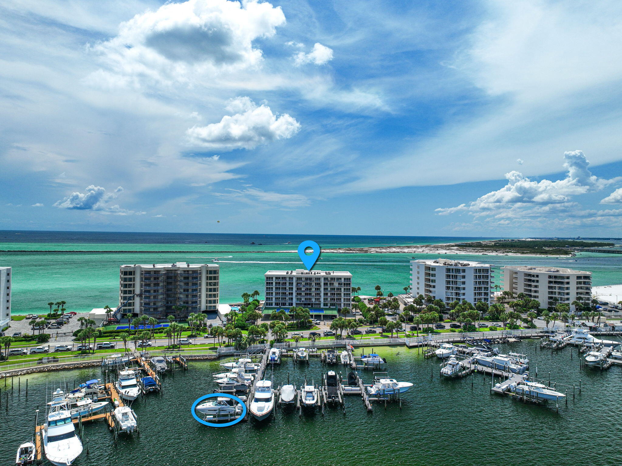 Step into coastal luxury at Waterview Towers Unit 303, a beautifully updated three-bedroom, three-bath (with additional Bunk Room) residence on Destin's exclusive Holiday Isle. With a private boat slip (#19) directly across the street and sweeping views of the Gulf, East Pass, and Destin Harbor from every bedroom, this waterfront escape delivers the ultimate Emerald Coast lifestyle.  Expansive windows bathe the space in natural light while showcasing uninterrupted water views. The chef-friendly kitchen flows seamlessly into the dining and lounge areas, creating the perfect backdrop for gatherings. Spacious bedrooms provide comfort and privacy, while full-width balconies bring the outdoors in. The unit includes a private boat slip