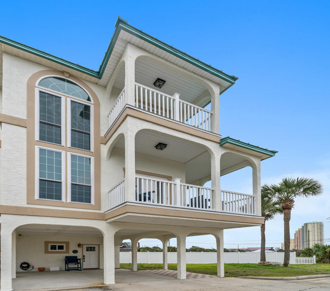 Welcome to your coastal getaway with Gulf views from every window! Located directly across from the beach, this recently updated fully furnished tri-level townhome offers three spacious bedrooms and three full bathrooms, with the ideal layout of one bedroom and one full bath on each level. It features a spacious family room area and a well-appointed kitchen with stainless steel appliances. Two covered Polywood balconies and a private patio. Two covered parking spaces plus one for a golf cart. The first-floor lock-out/studio unit includes a full bath, kitchenette, and patio, which is ideal for guests or generating rental income. Community pool, hot tub, and sauna steps away. Whether you're looking for a vacation home, investment property, or full-time residence, this coastal gem truly has it all.