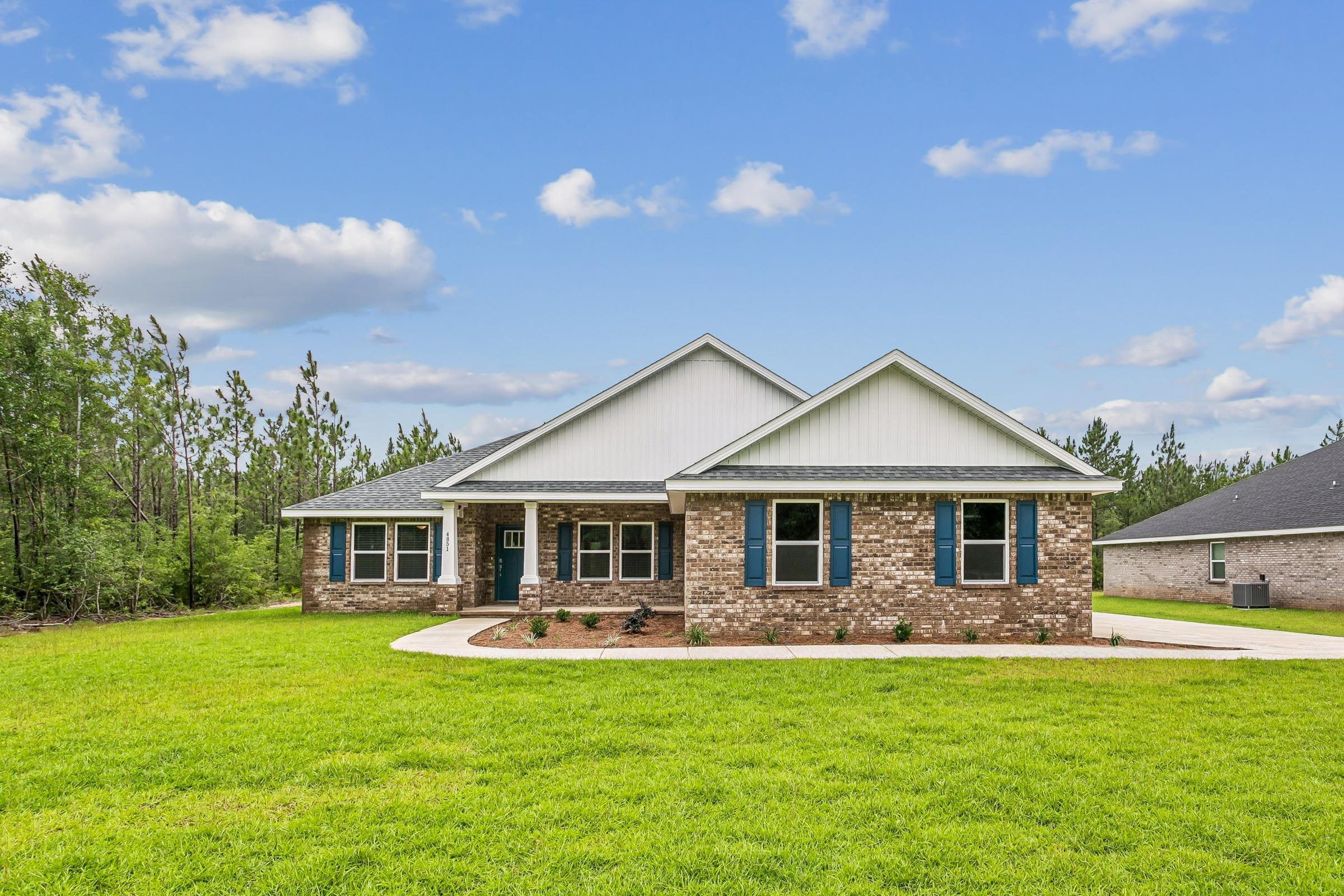 Welcome home to your new country estate for laid back living with all the conveniences of a modern, wonderfully built home. This stunning Sapphire Estate Floor Plan is situated on a .50 acre lot in the Prosperity Point community in Milton. Offering 4 bedrooms, 2 full bathrooms, and 2,404 square feet of beautifully designed living space, this home blends modern convenience with spacious country charm.
The homesite is tucked away in a quiet, low-traffic street  surrounded by nature, providing the perfect backdrop for privacy and peaceful living.
Inside, the home showcases Herbst Homes' signature quality and attention to detail, with upscale features throughout. You'll find high-end cabinetry, granite or quartz countertops, and premium finishes that elevate every space. The kitchen is equipped with stainless steel appliances, under cabinet lighting, soft close cabinets, a walk-in pantry, all designed for both function and beauty.
Additional upgrades include a whole-house blinds package, crown molding in the common areas, and durable luxury vinyl plank flooring. The spacious, split-bedroom layout includes a luxurious primary suite with a tray ceiling, tiled walk-in shower, garden tub, double vanities, and a generous walk-in closet. A side-entry three-car garage elevates curb appeal with a clean, upscale look while providing ample space and functionality. This home has it all!
Pictures are of a similar home, colors may vary. Projected completion is September 2026.