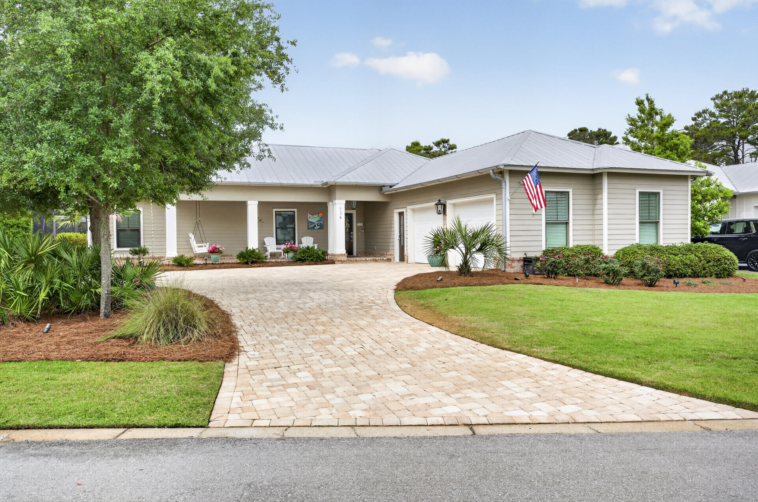 A rare opportunity to own a luxury coastal retreat with STRONG INVESTMENT appeal and no HOA restrictions in one of 30A's most sought-after locations in the heart of Old Seagrove Beach, this exceptional property captures the essence of elevated 30A living. Perfectly positioned on an oversized corner lot at the end of a quiet cul-de-sac, this meticulously maintained residence offers the ultimate blend of privacy, space, and walkability--where golf carts are a welcomed. With no HOA and convenient walking access to two beach easements leading to the Azalea and Gardenia entrances, as well as the 395 access, the location is simply unmatched. Enjoy biking, walking, or cruising to Seaside, Publix, and 30A's most sought-after dining and shopping. Designed to live like a primary residence yet perfectly suited as a second home or short-term rental, this meticulously cared-for property delivers a true resort-style experience. The private, fenced backyard is a special treat featuring large area of space to play. At the center of the home, an incredible outdoor living space creates the ultimate entertaining environment--complete with a resort-style pool and fountain, fully equipped outdoor kitchen and bar with grill, refrigerator, icemaker, pizza oven, sink, and ample storage. A dining area, half bath, enclosed outdoor shower, and a cozy living space with a brick fireplace make this courtyard a year-round retreat, all protected by a screened enclosure with newer screens for added comfort and durability. Seasonal panels allow for enclosed winter entertaining, adding even more versatility.

Inside, the home welcomes you with a private foyer. To one side, two guest bedrooms are connected by a Jack-and-Jill bath, both with direct access to the pool area. On the opposite side of the foyer, an additional bedroom and bath for guests. The exceptional oversized two-car garage opens into a thoughtfully designed mudroom with built-in storage, sink, folding space, and a large stackable washer and dryer--perfect for beach living.

The main living area is open, inviting, and designed for gathering. A spacious dining area easily accommodates eight or more guests and flows seamlessly into the living room, anchored by a stunning double-sided stone fireplace and a stylish wet bar with glass storage, wine rack, and mini fridge. The well-appointed kitchen features a large island with bar seating, abundant workspace, and a cozy keeping room with the fireplace's second side--creating warmth and connection throughout the space.

The rear of the home offers a generous guest suite with private bath, along with the added bonus of a second full laundry room. Just beyond, you'll find an expansive primary suite retreat featuring private sliders that open directly to the outdoor living area. The luxurious primary bath is designed for relaxation, highlighted by a spa-like steam shower that elevates the everyday experience.

Additional highlights include a whole-house Generac generator for peace of mind, extra parking, and a well-maintained paver driveway. Every detail has been thoughtfully curated, making this far from your ordinary beach home. Whether you're seeking a full-time residence, vacation retreat, or investment opportunity, this Seagrove gem captures the essence of elevated coastal living. Last but not least newer screens over the outdoor living and a well for your exterior irrigation.