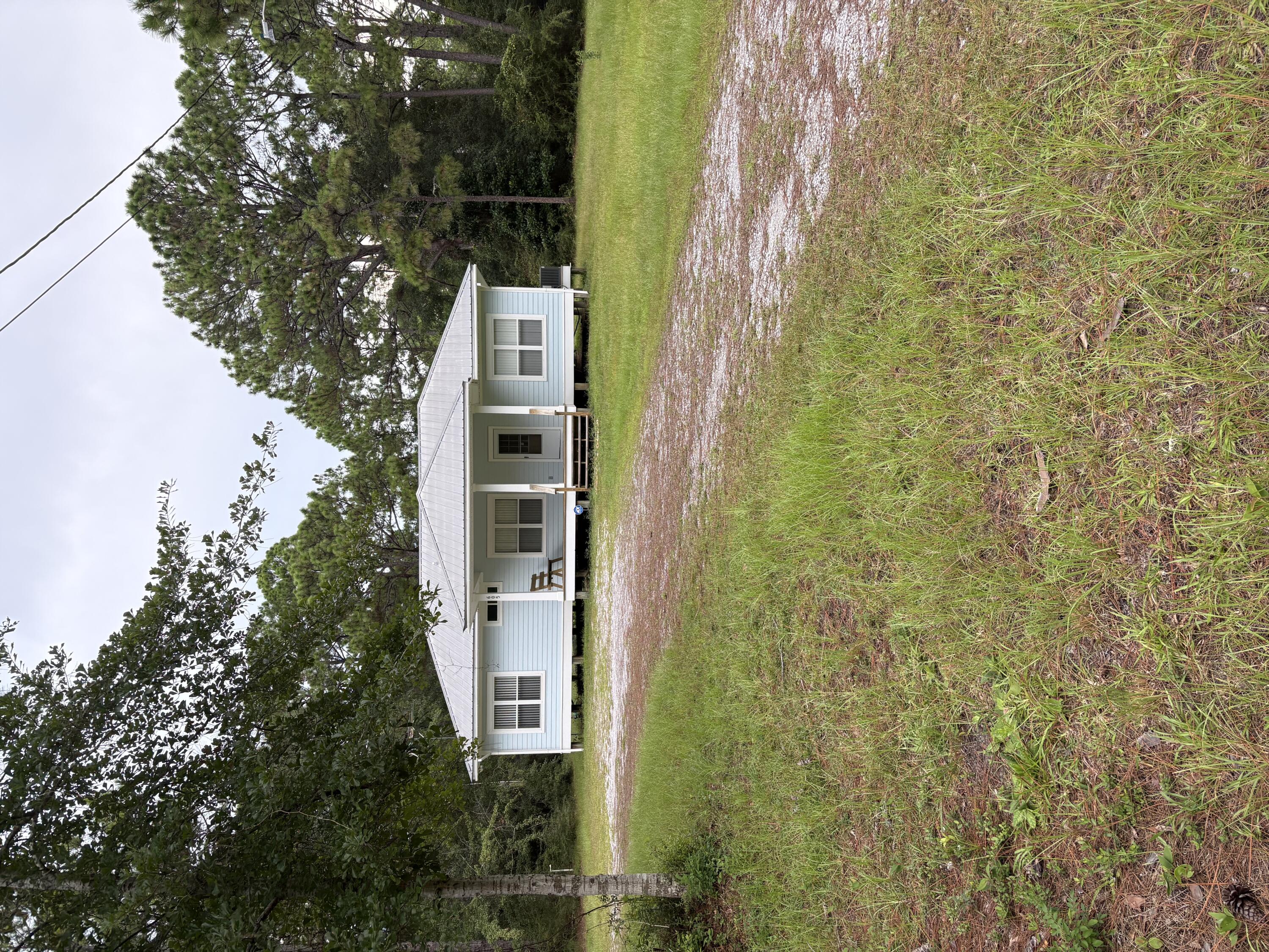 Charming original-owner single-family home, located in the heart of Santa Rosa Beach on 2.293 acres consisting of 8 platted lots of record. No HOA. This 3BR/2BA home incorporates the open concept living, kitchen, & dining areas with large, covered front and rear porches.  Located just minutes from Cessna Landing, white sand beaches, restaurants, & shopping.  Discover the perfect blend of location & value. Great opportunity for builder/developer or investor.
