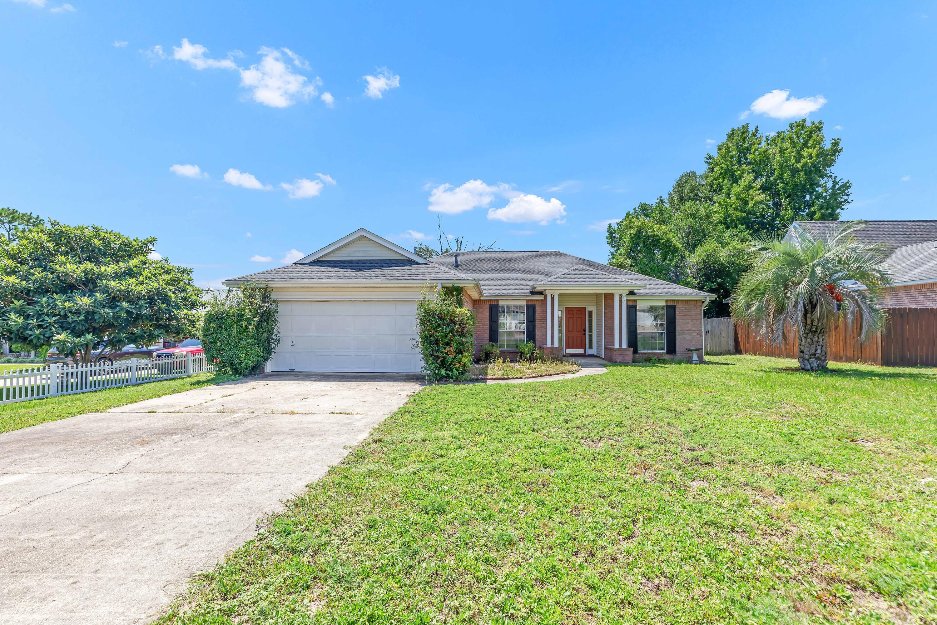 Welcome home! This property offers lots of great features like split floor plan, formal dining room, screened Florida room, fenced back yard, quiet non-thru street, tall ceilings, 2021 roof and brand new LVP flooring throughout. Primary bedroom is spacious with a large bathroom to include separate shower and tub. Walk in closet and private commode. Additional bedrooms are on the other side of home with a full bathroom located between the two. Living room offers tall ceilings with fireplace and a patio door leading you to the screened Florida room. No HOA. 
VA Assumable rate 3.25%