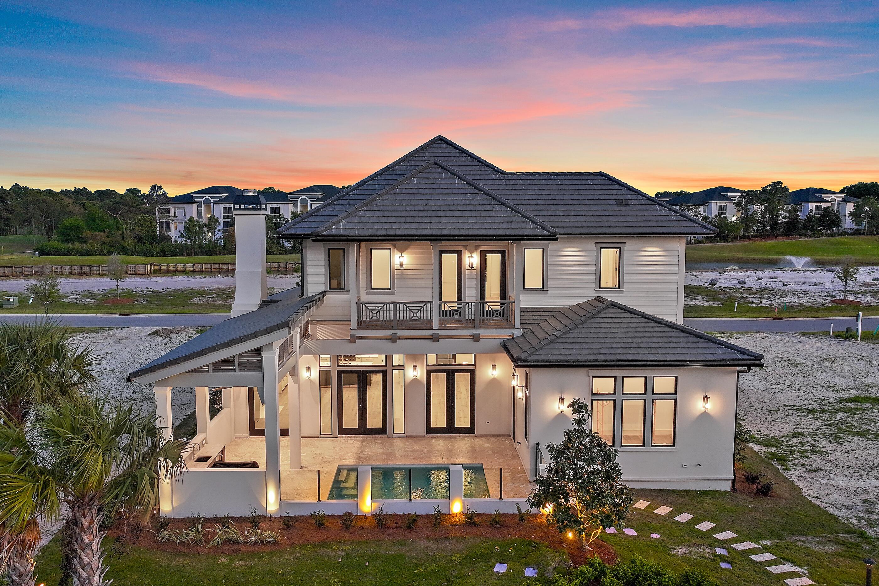 Less than a mile from the beach! Finishes and details are stunning! 
Introducing Tradewinds, the latest gem in Regatta Bay, featuring 54 exquisite homesites inspired by the architectural elegance of the West Indies and Dutch styles. This stunning, brand-new residence embodies modern luxury, seamlessly blending indoor and outdoor living across over 3,600 square feet of climate-controlled space. It boasts 4 bedrooms, 4 full bathrooms, and an additional half bath. The exterior showcases an inviting outdoor area, complete with a summer kitchen and a picturesque Alys Beach-style pool, making this home an ideal retreat for relaxation and entertainment. Click more for additional information.