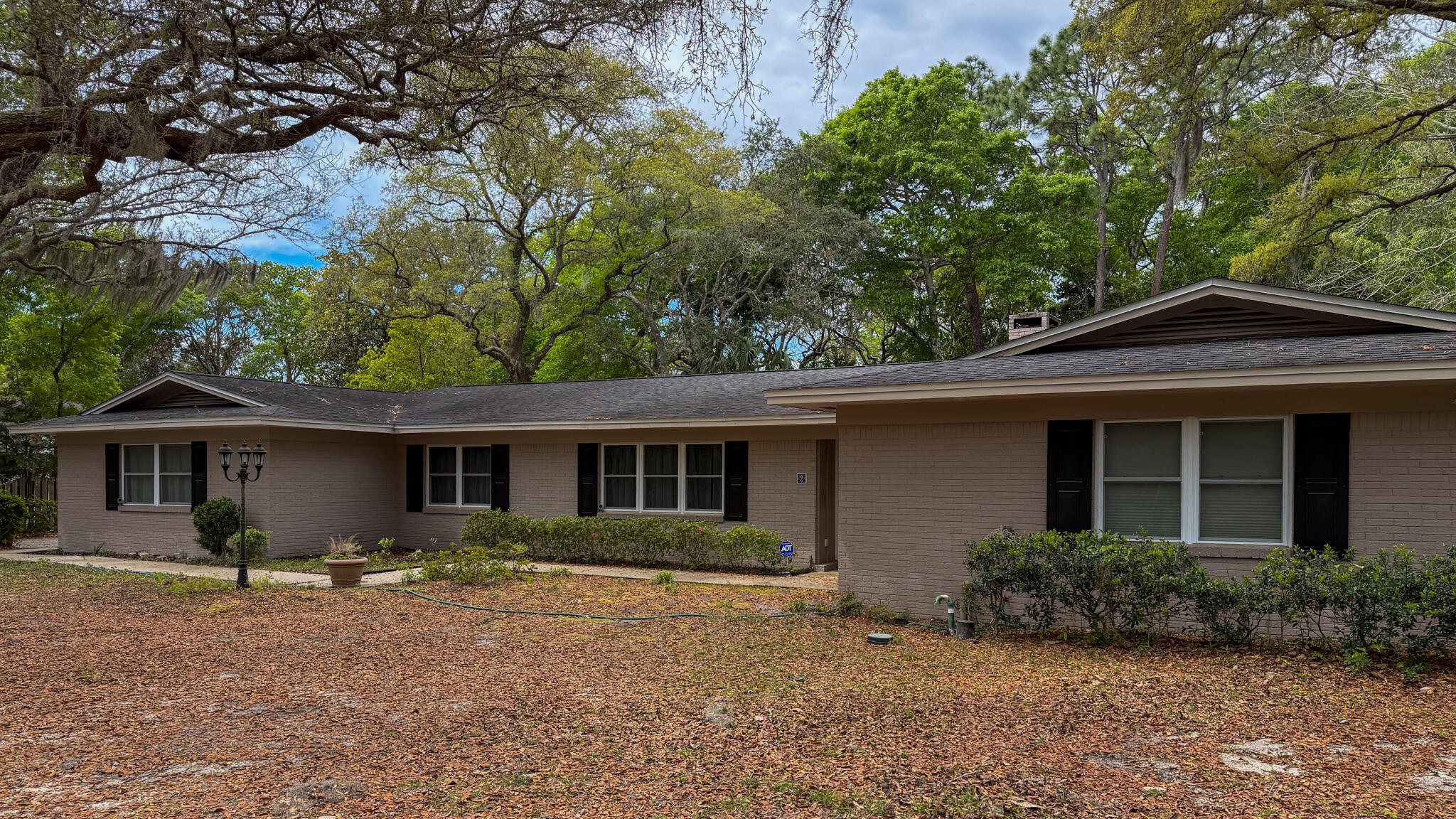 Located in one of the most beautiful areas off Mooney Rd! Over 2500 sf home in a sought-after & private neighborhood (no thru traffic!), with over .6 acres. House & neighborhood are full of Mature oak trees w/spanish moss.  Move in and make it your own! 4 bedrooms + office/flex space, Enjoy your formal living & formal dining  rooms with hardwood floors. House has a large den w/fireplace which leads out to the large pool & backyard. Kitchen & informal dining area also lead to the pool area.  SELLER IS OFFERING $5k FLOORING AT CLOSING W/ACCEPTABLE OFFER.. Create a backyard oasis with large fenced yard and IN-GROUND POOL, with new pool pump & Polaris Cleaner, House exterior was recently painted & new front door added, LED exterior lighting, ROOF 2017. HVAC 2023, WH 2026.  Attic has new insulation & updated wiring & the loose ductwork has been repaired. Chimney has been professionally cleaned & new cap spark arrestor added.  The intercom system is not connected & back yard shed are both "as is". The lead pipes have been cleaned out. Power lines are underground. Seller added a cedar closet to keep special clothes in good shape.  Looking for a 1 story, large house with a pool in a beautiful neighborhood, this is the house for you!!