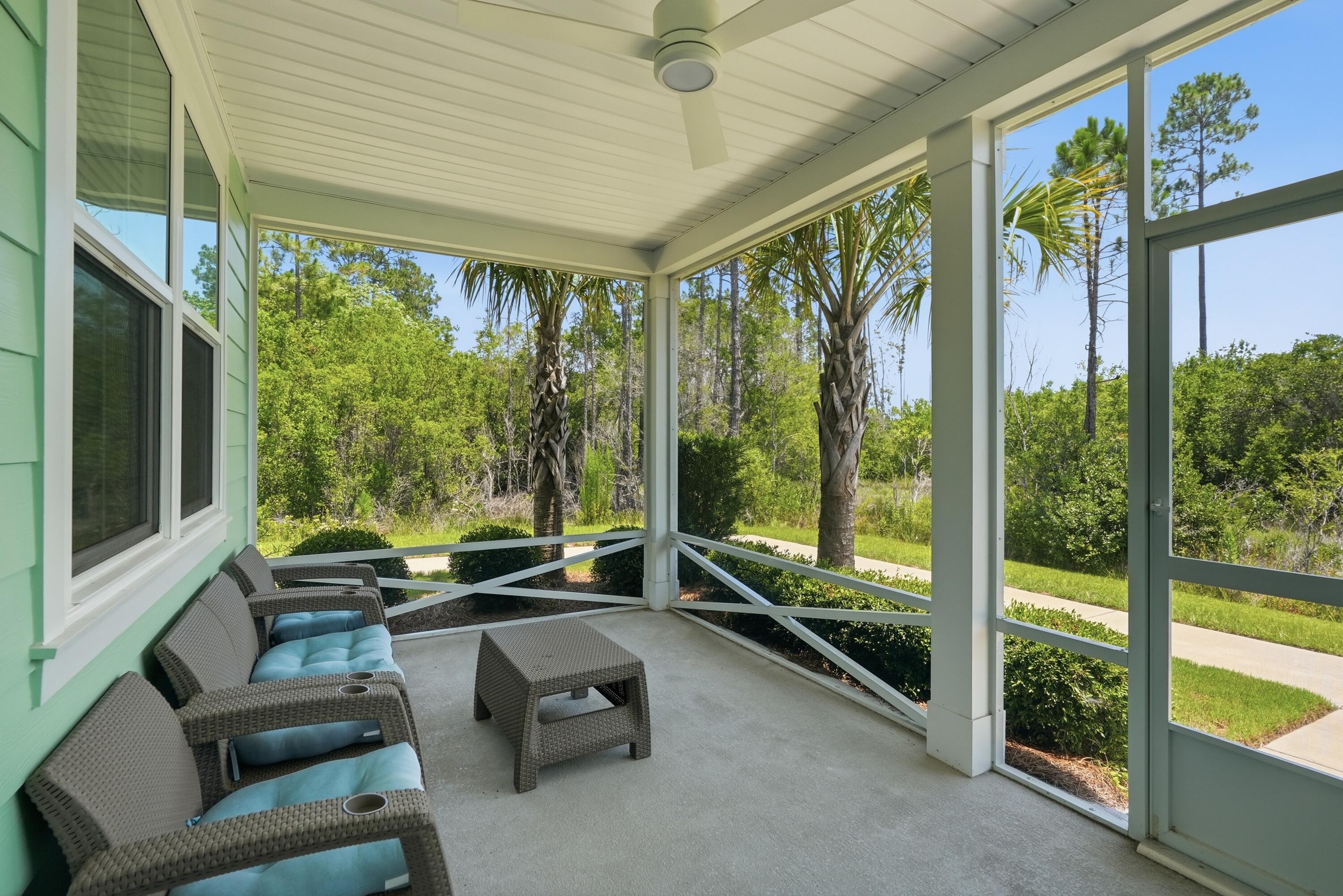 Amazing ALOHA on an AWESOME PRIVATE LOT! Experience coastal-inspired living in this beautifully maintained Aloha Cottage located in Latitude Margaritaville Watersound. Featuring two bedrooms plus a versatile den, this popular floor plan offers flexible living space and an open-concept design that blends comfort, functionality, and style. The standout feature of this home is its exceptional location. Situated with preserve space on both sides, it offers a level of privacy rarely found among cottage homes and creates a peaceful setting surrounded by natural beauty. Enjoy morning coffee or evening relaxation from the screened porch while taking in the tranquil preserve views. Inside, the spacious great room features vaulted ceilings and abundant natural light since you can keep the blinds open and still maintain privacy. The kitchen features a large center island, quartz countertops, upgraded cabinets, tile backsplash, and ample workspace for cooking and entertaining. A dedicated dining area provides the perfect setting for gatherings. The primary suite includes a generous walk-in closet, an ensuite bath with dual vanities, and a tiled walk-in shower. On the other side of the home, the guest bedroom and full bath provide spacious accommodations. The den offers endless possibilities as a home office, hobby room, media room, or additional guest space. Quality finishes throughout include Mohawk RevWood flooring in the main living areas, tile in wet areas, custom ceiling fans, and thoughtful design upgrades. 

Beyond the home, residents enjoy access to an impressive collection of resort-style amenities, including a waterfront pool, restaurant, fitness center, indoor lap pool, spa, pickleball and tennis courts, kayaking, bocce ball, cornhole, live entertainment, and a full calendar of social activities. Additional shopping, dining, medical, and marina offerings are planned for the surrounding area, adding even more convenience and lifestyle opportunities. Located just minutes from the Emerald Coast's renowned white-sand beaches, this home combines a private preserve setting with easy access to everything the area has to offer. HOA-maintained lawn care and scheduled exterior maintenance provide a low-maintenance lifestyle, allowing more time to enjoy the community and coastal surroundings. Opportunities to own an Aloha Cottage with this level of privacy are uncommon. Come discover what makes this homesite one of the most desirable cottage locations in the Active 55+ community of Latitude Margaritaville Watersound!
