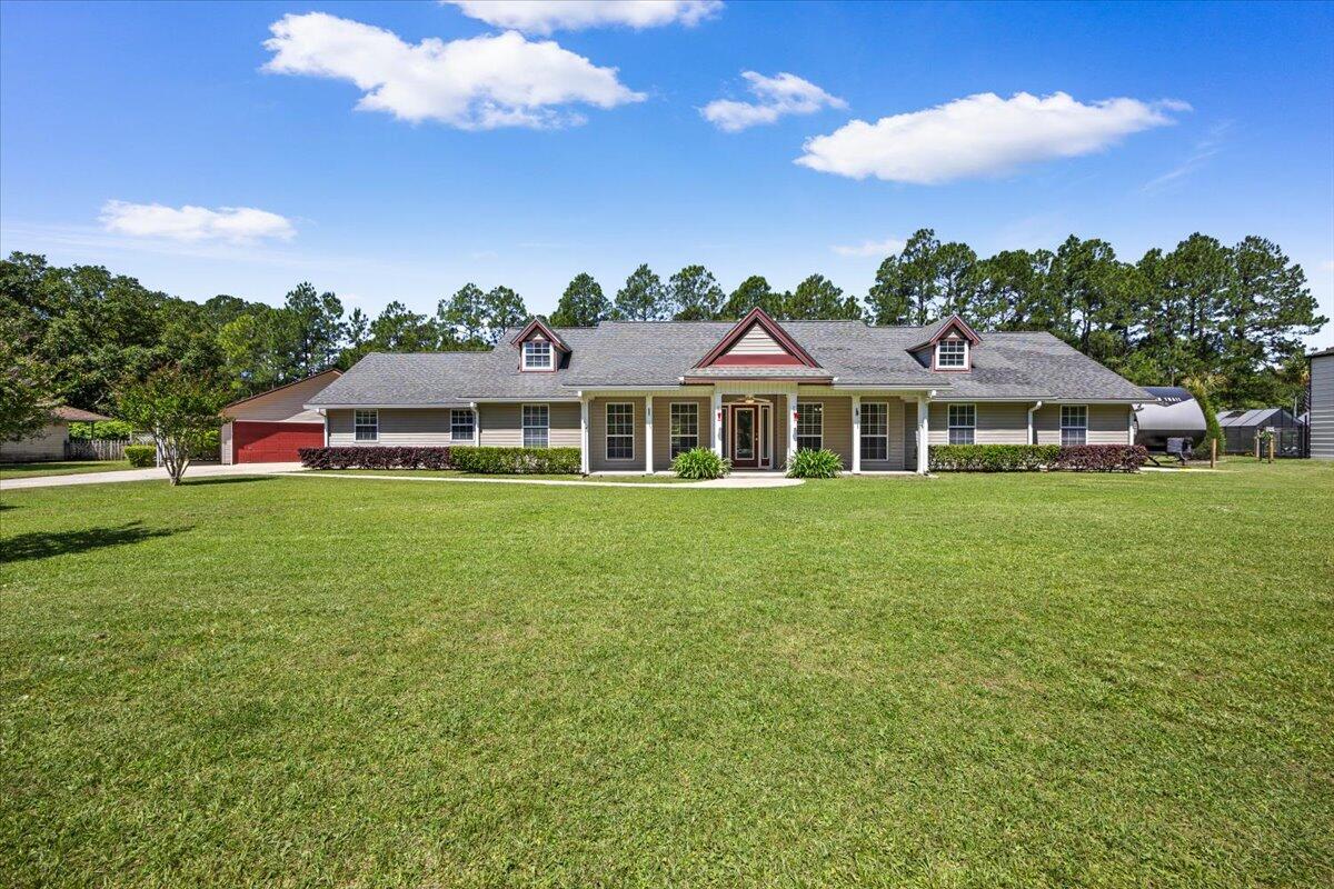 Welcome to a comfortable country retreat tucked into the highly desired Waterview Estates of Milton, Florida. From the moment you arrive, this 4-bedroom, 3-full-bath home invites you to slow down, breathe deep, and settle in -- offering 2,476 square feet of easy, relaxed living on a peaceful, canal-front lot.

Step inside to find generous space for the everyone, the bedrooms have been thoughtfully arranged for everyday comfort and weekend gatherings alike. The attached two-car garage keeps daily life simple and organized, while the true magic of this property waits just out the back door.Approximately 180 feet of waterfront line a calm, shallow canal that is tailor-made for kayaking and paddle boarding right from your own backyard. A voluntary HOA grants access to the community dock and boat launch, opening the door to sun-soaked days out on the bay whenever the mood strikes.

Hobbyists, makers, and outdoor enthusiasts will fall in love with the detached 612-square-foot garage, currently used as a workshop. It features a functional half bath already plumbed for a shower, making a future full-bath conversion a simple upgrade. A covered cement pad on the south side offers the perfect spot to park a boat, while the north side boasts a screened-in porch complete with a built-in bartop and direct access to that half bath -- an ideal place to gather and unwind after a day on the water.

Thoughtful touches continue across the grounds. A portion of the backyard is enclosed with a chain-link fence, giving pets a safe, secure space to roam outdoors unattended. On the north side of the property, a cement pad with a 30-amp hookup stands ready to welcome and power a recreational vehicle -- perfect for the traveler at heart.

Best of all, this comfortable country setting never asks you to give up convenience. You are just minutes from Interstate 10 and Whiting Field, with an easy drive to the sugar-white sands of Pensacola Beach and all the restaurants and shopping you could want close at hand. It is the rare property that delivers room to breathe, space to play, and connection to everything you need.
Country comfort, waterfront living, and unbeatable convenience -- 3171 Waterview Drive is ready to welcome you home.