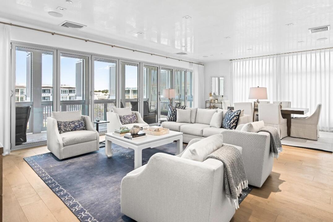 Highly desired top floor 3 bedroom plus bunk Alys Beach Town Center condo. Expansive Bi-folding doors open the kitchen, dining and living areas to a large covered porch with views west over the amphitheater and towards the newly completed Beach Club.