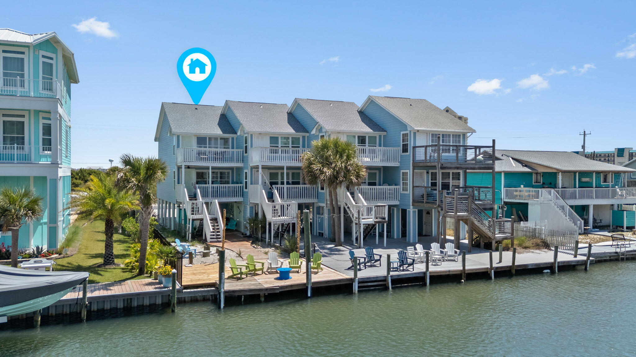 Welcome to ''The Salty Flamingo''! Waterfront living meets income potential in this updated canal-front townhome with direct access to the Santa Rosa Sound. Located in Navarre Landing on iconic Navarre Beach, this 3 bedroom, 2.5 bath end unit offers nearly 1,200 square feet of thoughtfully designed coastal living with 26 feet of direct waterfront access, no HOA, and short-term rentals allowed. Inside, the home is filled with natural light and coastal character, featuring an open-concept layout, durable vinyl plank flooring, and a beautifully updated space. The fun, cohesive design and curated furnishings carry throughout, creating a memorable guest experience that supports strong rental appeal or a fantastic primary residence for those looking to slow down and enjoy the beach lifestyle. Upstairs, spacious bedrooms include a primary suite with private balcony access overlooking the canal - perfect for morning coffee or unwinding after a day on the water. Step outside and experience what truly sets this property apart. The expansive waterfront deck is built for enjoying and entertaining, complete with string lighting, multiple seating areas, and direct canal access. Fish off the dock, launch a kayak or paddleboard, or cruise out to the Sound with ease on your boat (there's room to dock it at your own property!). The backyard also features a fire pit area, tiki bar, and outdoor shower offering the ultimate coastal lifestyle for owners and guests alike. Have peace of mind with major exterior upgrades including a new roof in 2024, a new heater and a full replumbing to pex in 2025. Offered fully furnished and rental-ready, this property is truly turnkey - continue operating it as a successful short-term rental or enjoy it as your own private waterfront retreat. Welcome home!