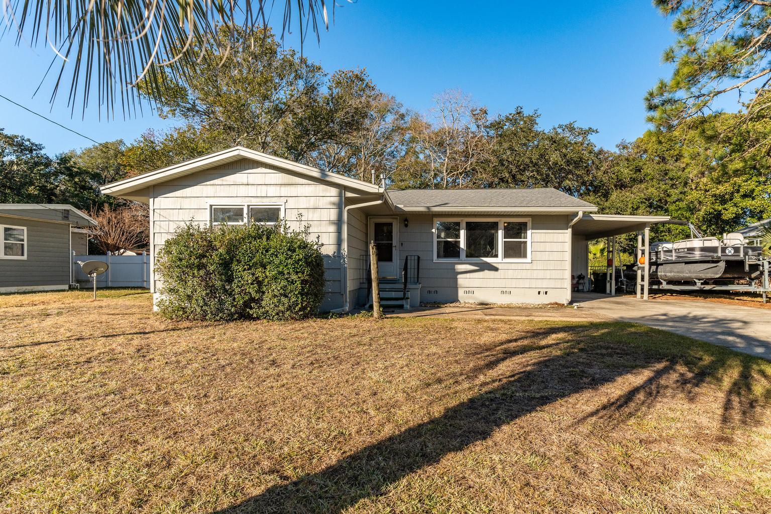 ** NEW PHOTOS TO BE COMPLETED SOON, THESE ARE OF OLD LISTING, HOUSE IS NOW VACANT ON BOTH SIDES**

The perfect investment property! 

Discover this unique 4-bedroom, 2-bathroom home in Fort Walton Beach, FL, situated on a spacious 0.25-acre level lot. Featuring a versatile floor plan, this home offers two separate living spaces under one roof, providing flexibility and privacy.

The main section of the home is accessible from both the front and back doors and includes a generous living room, dining area, kitchen with pantry, a master bedroom with his-and-hers closets, a full bathroom, and two additional bedrooms. Bedroom three conveniently connects to a hallway leading to the second living area.

The second living space has its own private entry and exit, offering a full kitchen, living room, bedroom, and full bathroom ideal for accommodating aging family members while maintaining independence or as a potential rental income opportunity.

Additional features of this property include a covered carport, utility room, yard building, and an oversized driveway with ample parking. The home is equipped with a durable dimensional shingle roof with gutters and a lawn pump for irrigation.

With endless possibilities, this property is ready for your personal touch make it yours today!