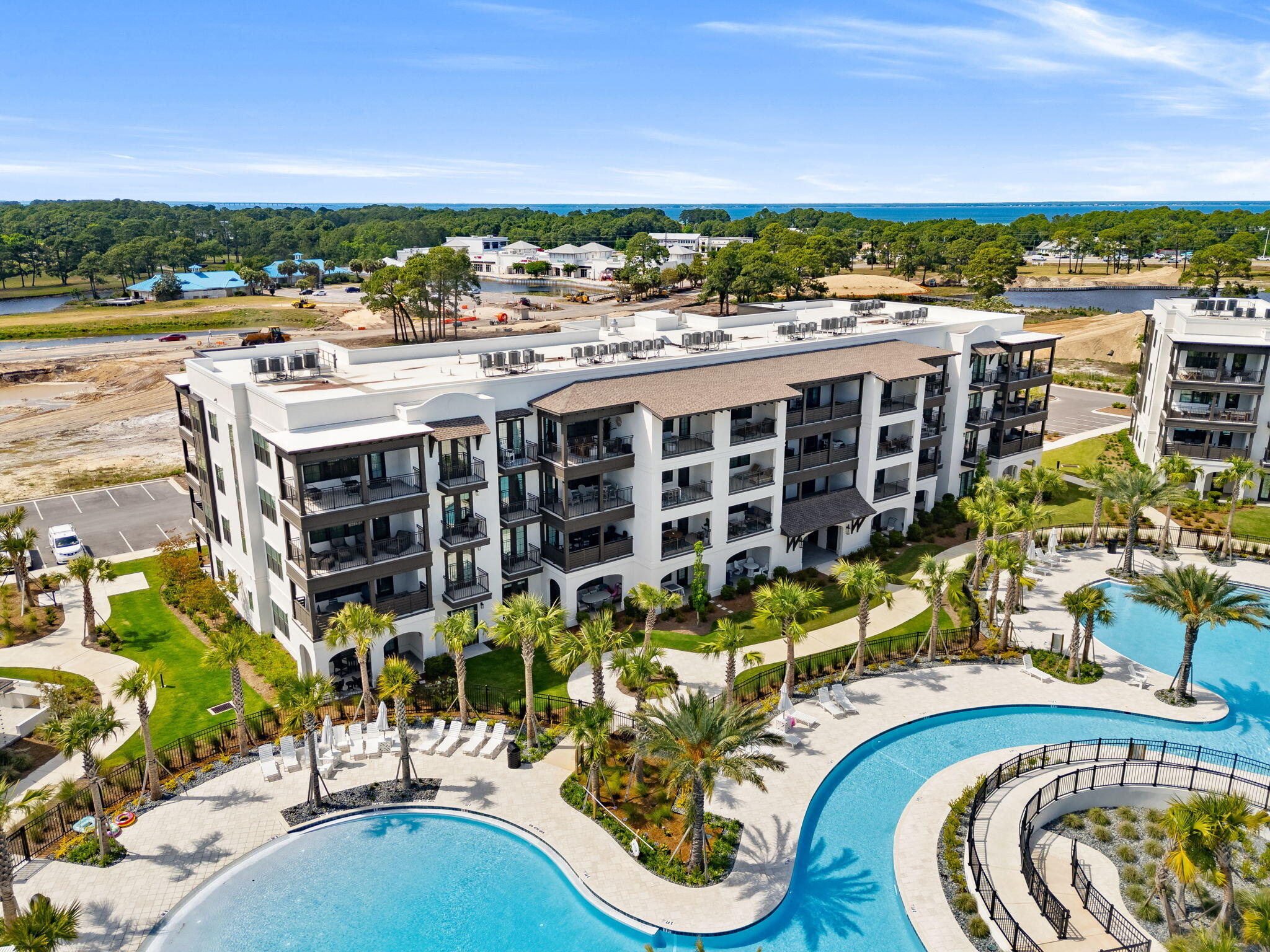 Exclusive opportunity to own one of the 6 remaining new units at The Grove at Seascape. Unparalleled amenities, design and interior finishes all within the guard gated Seascape community. Situated in the lively amenity area viewing pools, this unit features high end quartz countertops, Bosch appliances with gas cooking, a spacious island for entertaining and a work desk space. Split bedroom plan with 2 full baths plus a private bunk room and walk in laundry room. The primary bedroom features doors onto the covered balcony. The community overlooks the Aquatic Garden amenities featuring lush landscaped grounds, multiple pools including a relaxing lazy river, zero entry pool with exclusive use by the Grove owners and guests. Included by developer in the purchase is a 12 month lease for a storage closet situated on the ground floor.