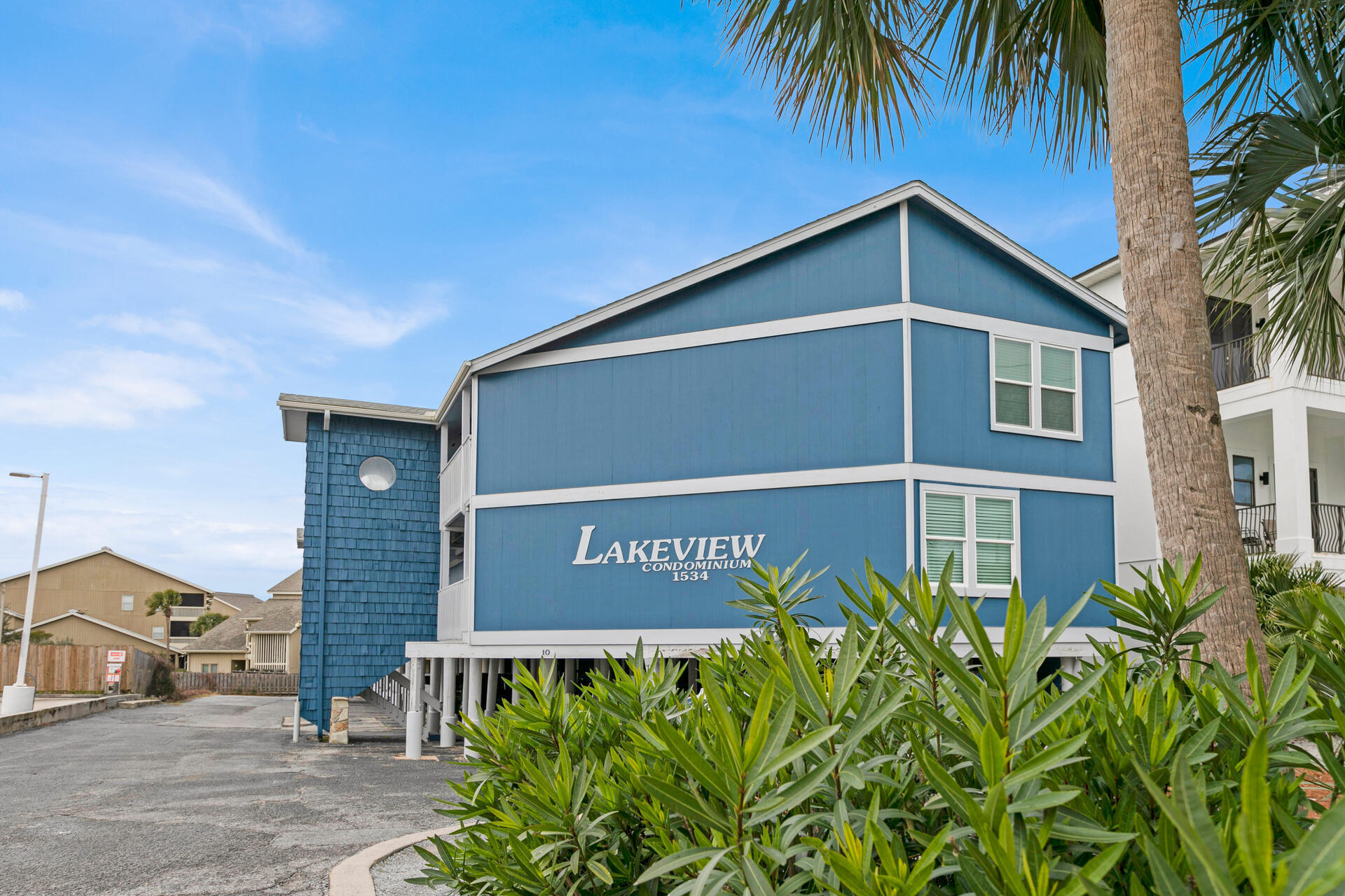 Steps away from the Deeded Private beach Access.  This Unit in Miramar  is one of the best kept secrets along Scenic Drive. This is a delightful, beachy, well maintained one-bedroom condo nestled next to Seascape in the Lakeview Condo community on Scenic Drive. Boasting a private deeded beach access, this residence offers the ultimate blend of convenience and coastal living. With stunning beach sunsets and a prime location, this condo is perfect for the short term rentals or the long term resident. The kitchen and bathrooms have granite countertops and luxury vinyl flooring throughout the unit.  Enjoy your coffee on the balcony with a view of the lake.  This unit would be wonderful for a short term rental or a cozy home.