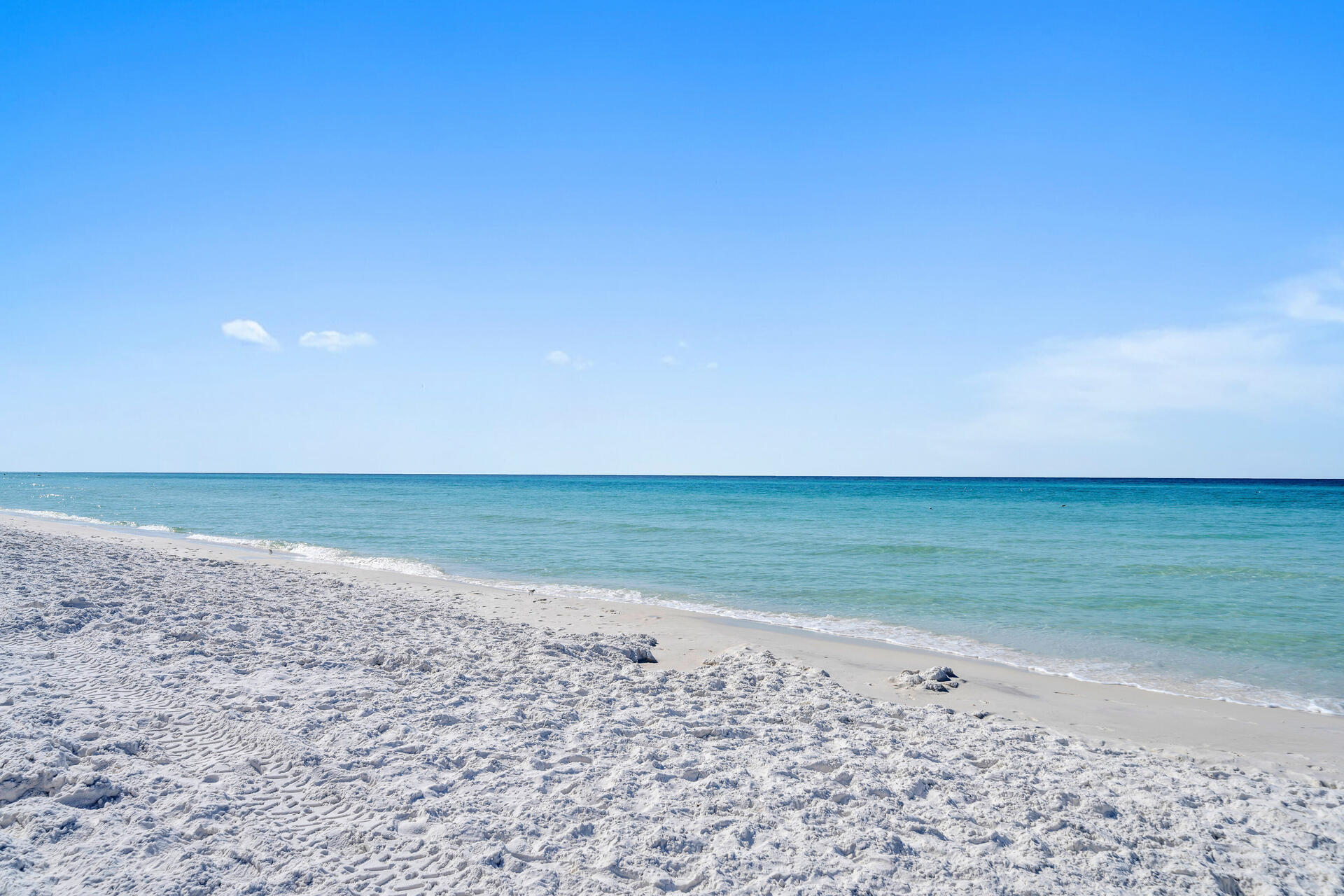 Steps away from the Deeded Private beach Access.  This Unit in Miramar  is one of the best kept secrets along Scenic Drive. This is a delightful, beachy, well maintained one-bedroom condo nestled next to Seascape in the Lakeview Condo community on Scenic Drive. Boasting a private deeded beach access, this residence offers the ultimate blend of convenience and coastal living. With stunning beach sunsets and a prime location, this condo is perfect for the short term rentals or the long term resident. The kitchen and bathrooms have granite countertops and luxury vinyl flooring throughout the unit.  Enjoy your coffee on the balcony with a view of the lake.  This unit would be wonderful for a short term rental or a cozy home.