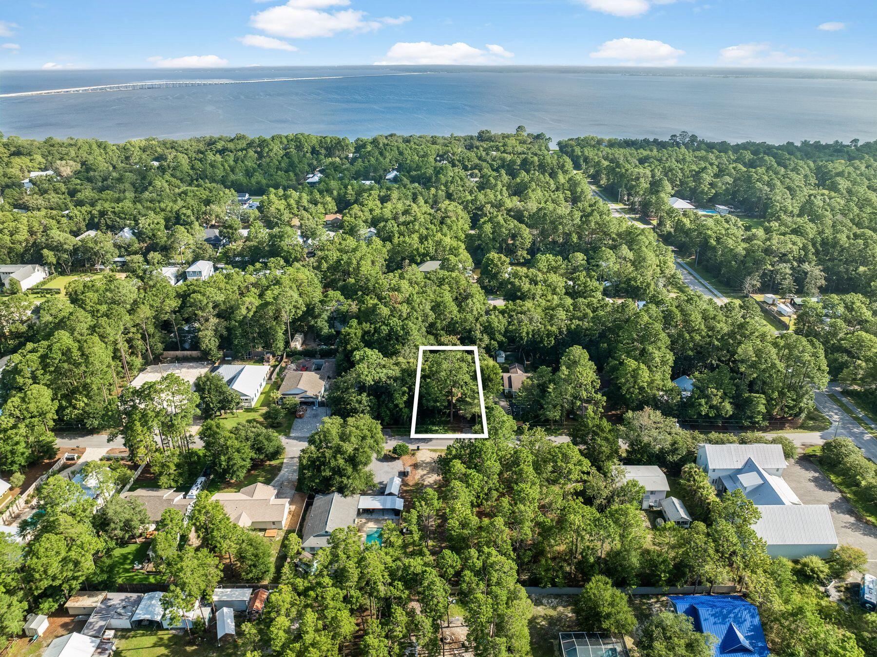 Rare opportunity to own a beautiful, private 0.25-acre homesite in the highly sought-after Daughettes area of Point Washington. Surrounded by soaring oak, magnolia, and cypress trees, this exceptional property offers a peaceful, natural setting that is increasingly difficult to find. An existing block-constructed home conveys at no value, though it features a new roof. Tap fees have already been paid, adding value for future plans. Ideally located just minutes from Choctawhatchee Bay, Tom's Landing Marina, community docks, and the white-sand beaches of Grayton Beach, this is the perfect location to build your dream home or investment property in one of the area's most desirable neighborhoods.
