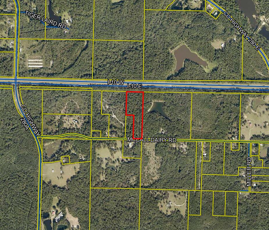 12.98 wooded and peaceful acres close to everything.  Discover the perfect blend of privacy and nature, but be just minutes from Historical Lake Defuniak  and downtown.  The property has 2 parcel IDs and sits on a paved county road.  This offers a true country feel wile being just minutes from town.  The property has large trees and would make a great homesite or even 2 homesites with acreage.  This one will not last long at this price.