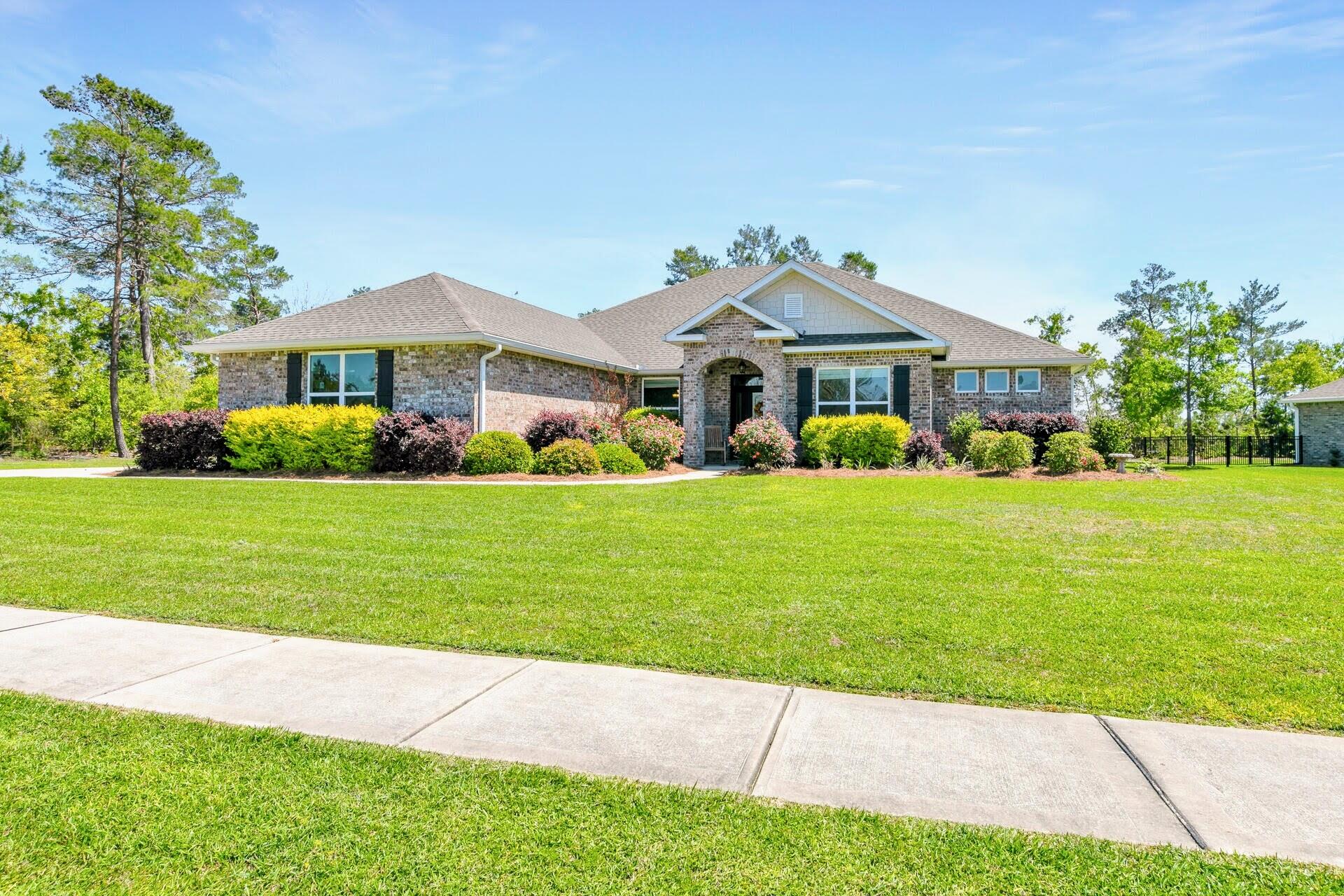 Welcome to 487 Coastal Breeze, a stunning 2,931 sq. ft. residence where luxury, comfort, and location converge. Situated on over half an acre in Windswept Estates, this one-owner home offers a rare blend of golf course views and ultimate family functionality.

THE KITCHEN: Oversized social island, walk-in pantry, and seamless open-concept design.

PRIMARY SUITE: A private wing featuring a spa-like bath and dual walk-in closets.

OUTDOORS: Expansive screened porch overlooking a newly fenced, park-like backyard with a gated entrance and full irrigation.

KEY EXTRAS: Full generator hookup, 2019 build, wood flooring throughout (zero carpet), and massive laundry storage.

THE LOCATION: Low Walton County taxes, and short drive to the Emerald Coast beaches or Eglin Air Force Base. Experience Luxury & Tranquility in Walton County

Chef's Dream: Oversized island, generous pantry, and seamless open-concept flow.

Primary Retreat: Private wing featuring a spa-bath and dual walk-in closets.

Practical Luxury: Oversized 2-car garage, massive laundry/storage, and full generator hookup.

Outdoor Oasis: Newly fenced yard with irrigation and an expansive screened porch overlooking a lush, park-like setting.

The Location Advantage: Enjoy the 30A coastal lifestyle with the benefit of lower Walton County taxes.