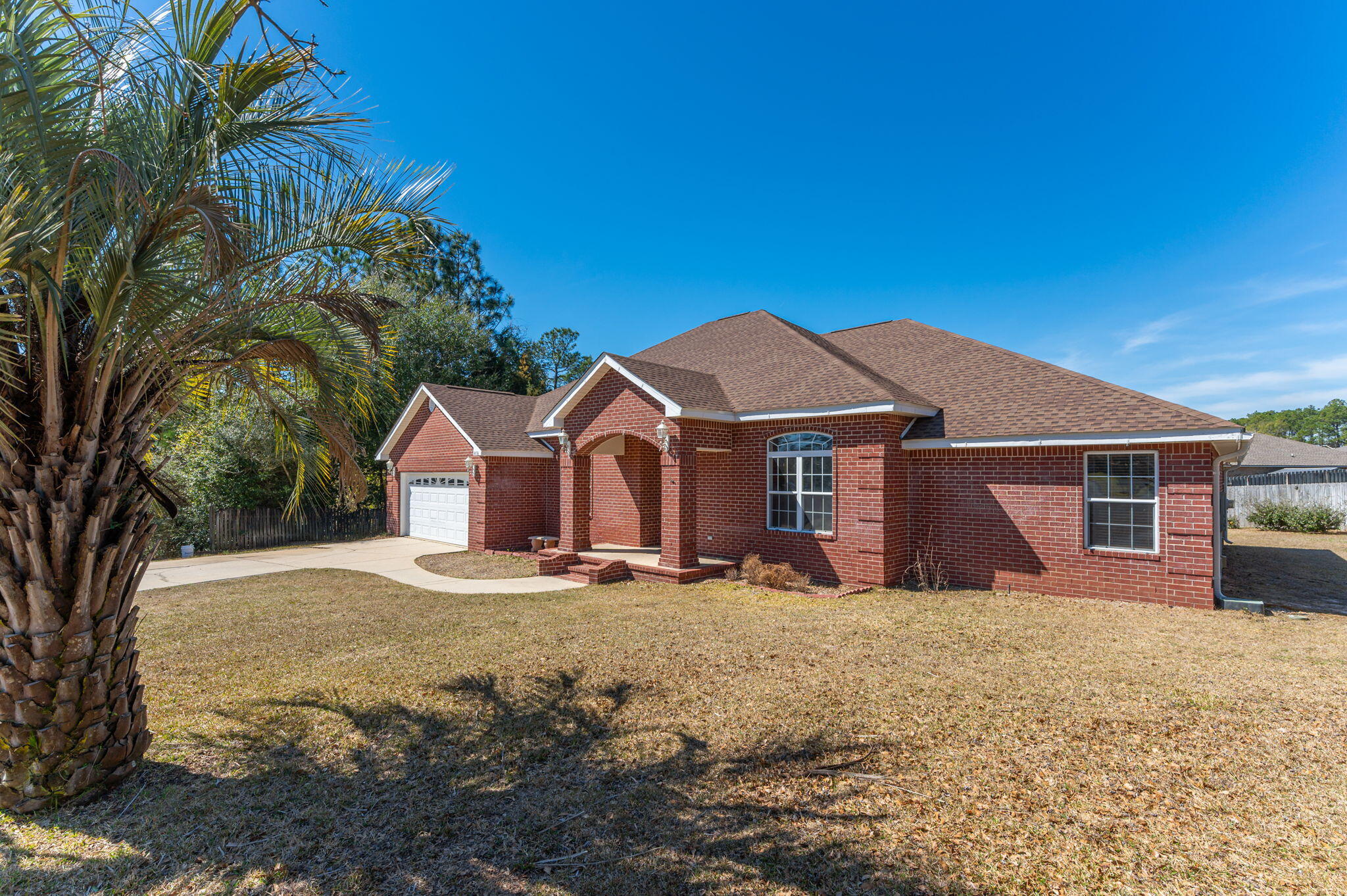 SELLERS WILL CONTRIBUTE UP TO $10,000 TOWARD BUYER'S CLOSING COSTS!!! Situated on a spacious lot in a quiet cul-de-sac in South Crestview, this impressive home offers nearly 4,000 sq ft under roof and an ideal blend of comfort and functionality. Step through the grand foyer into a semi-open floor plan featuring an expansive living room with elevated ceilings and a stunning stone fireplace surround with gas insert. The kitchen is beautifully appointed with abundant solid wood cabinetry, granite countertops, stainless steel appliances, and an adjacent formal dining room--perfect for hosting gatherings. Designed with flexibility in mind, the home includes two versatile flex spaces ideal for a home office, playroom, or additional living area. The oversized primary suite is a true retreat,  boasting a luxurious en-suite bathroom with a very large walk-in closet, dual vanities, a garden tub, and a separate shower. A thoughtful layout provides direct access from the primary bath to the oversized laundry room for added convenience. Guest bedrooms are generously sized and thoughtfully arranged within a split floor plan for enhanced privacy. Step outside to your private backyard oasis featuring covered patios accessible from both the living room and primary suite--ideal for entertaining or relaxing. Enjoy the sparkling screened-in pool and additional storage with a yard building that conveys as-is. The property also features a sprinkler system with lawn pump AND well (which supplies the sprinkler system only). NEW ROOF AND HVAC in 2021 along with numerous other updates! This South Crestview gem combines space, smart design, and exceptional outdoor living--ready to welcome you home.