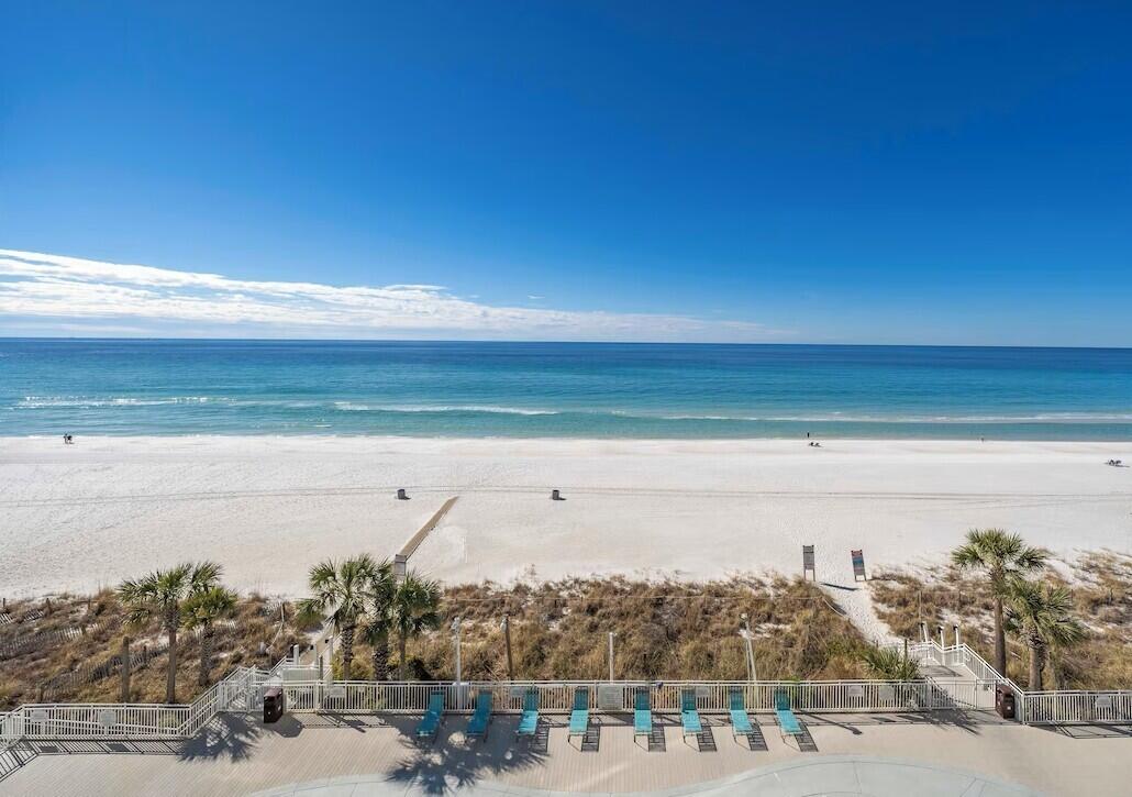 Exceptionally clean and spacious 1379 square foot condo with a large, covered balcony overlooking the beach and pools. Condo has recently been updated with newer appliances, shaker white cabinets and quartz counters. Furniture included, newer mattresses and high thread count sheets. Newer comfortable living room furniture and 75'' 4K Smart TV. Cable included in condo dues. Resort Amenities: tennis, pickle ball, shuffleboard, bocce ball, racket ball, work out room and more. All the equipment included. Large pool, jacuzzi and baby pool with decks facing the ocean. Affordable poolside restaurant. A large front load washer and dryer in unit. Secure parking.
