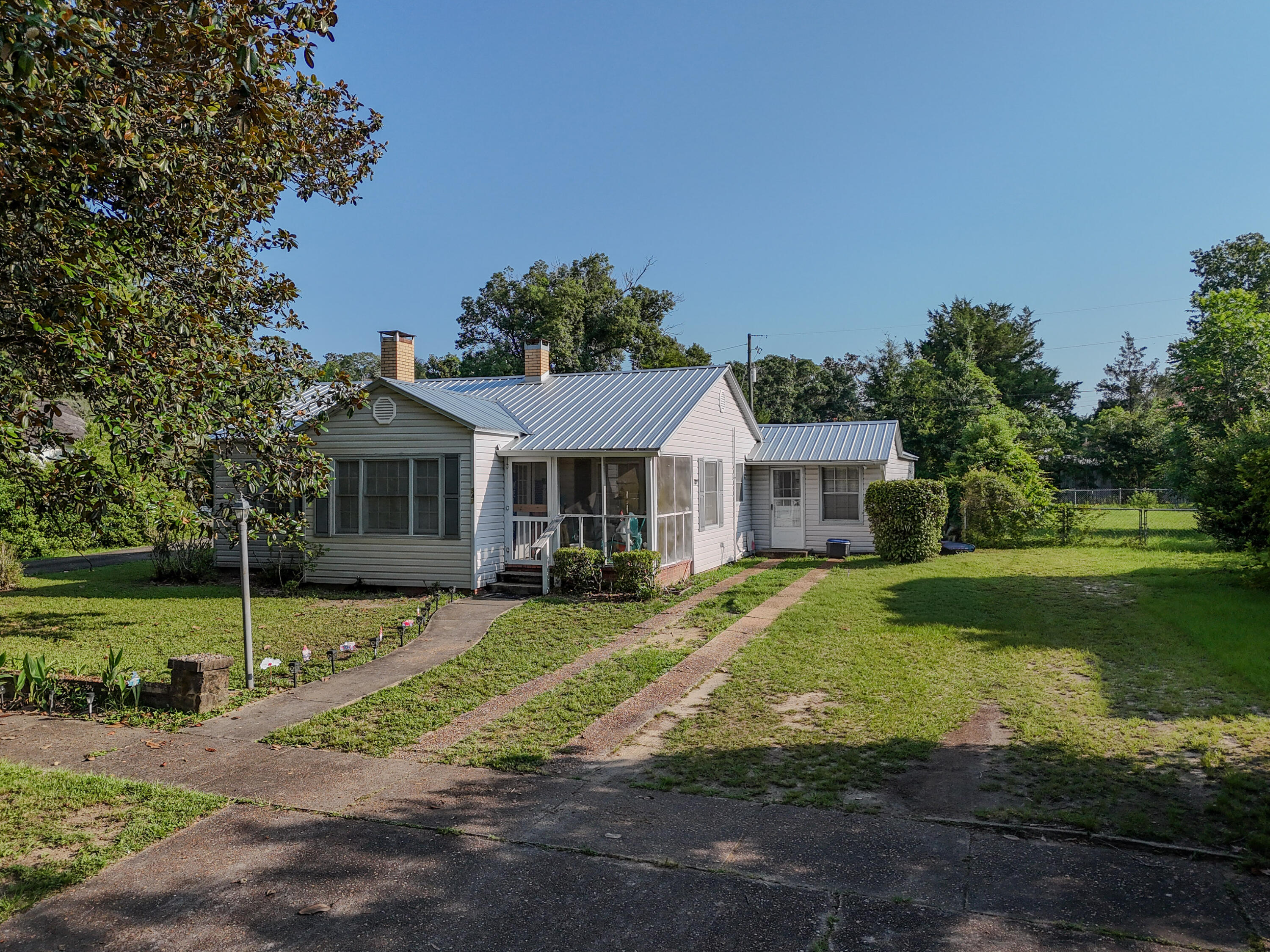 Discover the charm of historic DeFuniak Springs in this delightful 3-bedroom, 2-bath home, originally built in 1920 and offering 1,213 square feet of comfortable heated and cooled living space. Full of character and timeless appeal, this inviting home is perfect for those seeking a blend of classic architecture and modern-day convenience.

The thoughtfully designed floor plan makes excellent use of every square foot, creating a warm and welcoming atmosphere that's ideal for everyday living. Natural light fills the home, while the three bedrooms and two full bathrooms provide flexibility for families, guests, or a home office.

Located just minutes from beautiful Lake DeFuniak, you'll enjoy easy access to scenic walking trails, neighborhood parks, playgrounds, local restaurants, shopping, and the vibrant downtown district. Whether you're taking an evening stroll around the lake, attending one of the city's popular festivals, or exploring the historic charm of downtown, you'll love having it all just moments from your front door.

This home presents an excellent opportunity for first-time buyers, those looking to downsize, or investors seeking a property in one of DeFuniak Springs' most desirable historic neighborhoods. With its unbeatable location, timeless character, and inviting feel, this is a home you'll want to see in person. Schedule your private showing today and experience everything this charming property has to offer!

Roof (2024), HVAC (2022), Hot Water Heater (2009