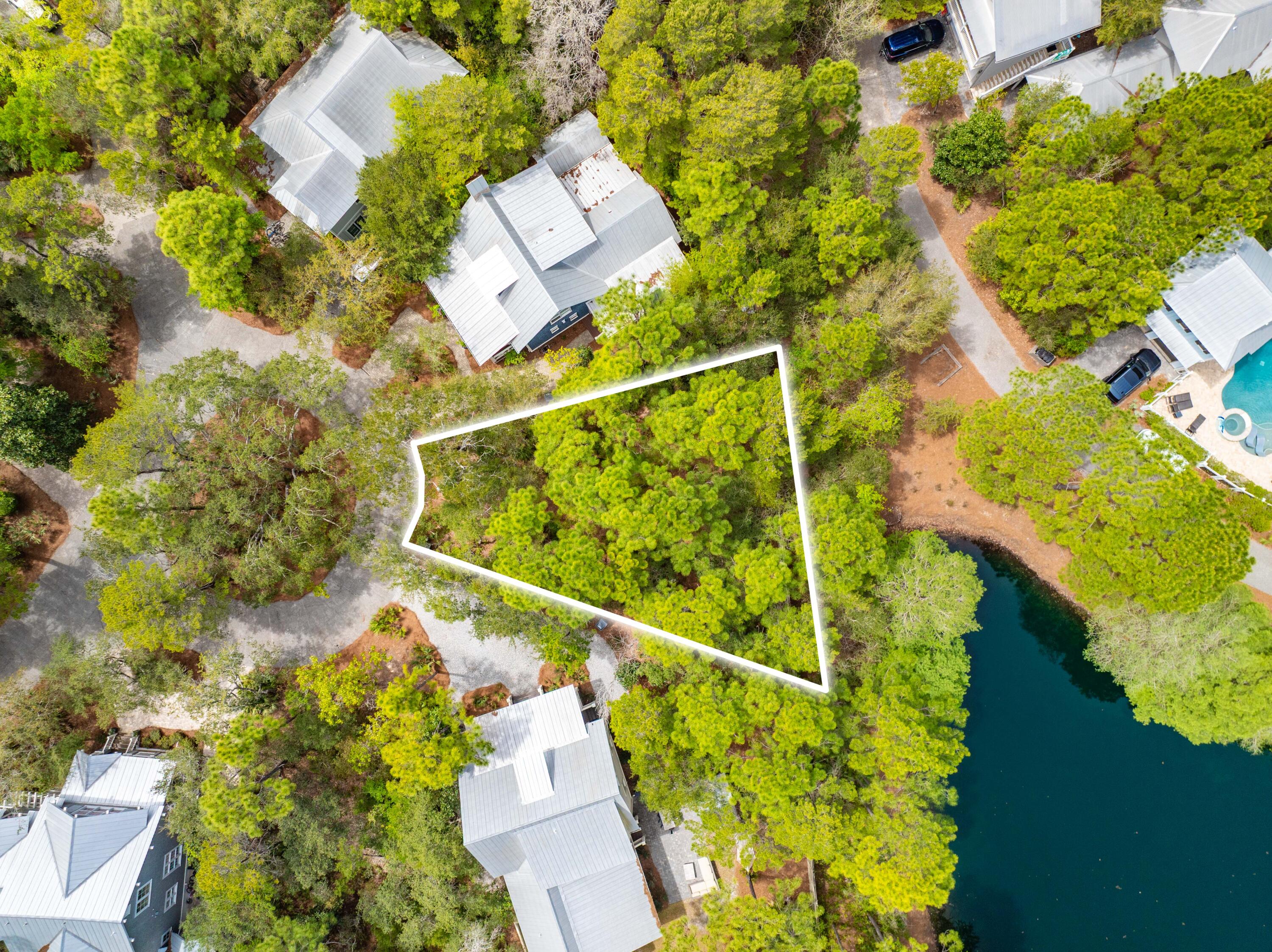 Prime vacant lot in the gated community of The Hammocks in Old Seagrove. Build your custom beach home, on one of the few remaining lots -  perfect as a 2nd home or full time residence.  Lot features HIGH ELEVATION and privacy, backing  up to green space behind WaterColor. The Hammocks also offers two community pools for residents. Community is ideally located within walking distance to the beach, restaurants, and retail.