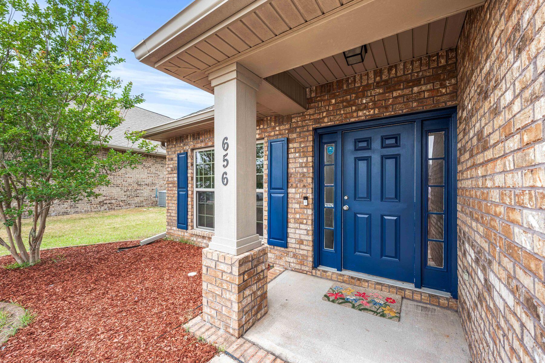 Set near the front of Redstone Commons with convenient access to the neighborhood amenities, elementary and middle schools this well-cared-for three-bedroom home with an additional office offers comfortable living, thoughtful upgrades and a floor plan designed for everyday ease. Fresh interior paint, new laminate flooring, newly installed quarter round and a recently painted front door create a polished first impression from the moment you arrive. Inside, the foyer opens into a spacious layout with tray ceilings, crown molding and LVP flooring throughout the home. The open-concept kitchen features attractive cabinetry, granite countertops, stainless steel appliances, a new French-style refrigerator and new oven, both added in 2025. A dedicated office or flex room adds valuable versatility for remote work, hobbies or additional guest space. The split-bedroom layout provides privacy, with a generous primary suite offering room for king-sized furnishings, a walk-in closet and a large bath with double vanity, walk-in shower and separate garden tub. Outdoor spaces have been refreshed with care, including a screened porch ideal for morning coffee, a re-tilled and replanted backyard with Bermuda grass, a stone fire pit and fresh mulch in the front yard. Additional improvements include a new water backflow system that has been inspected by the City of Crestview. Redstone Commons offers a pool, clubhouse, outdoor kitchen grill and picnic area, playground and dog park, creating a well-rounded setting for recreation, gathering and daily enjoyment. With more upgrades than many homes at this price point, this property presents an inviting opportunity in a convenient Crestview location.
