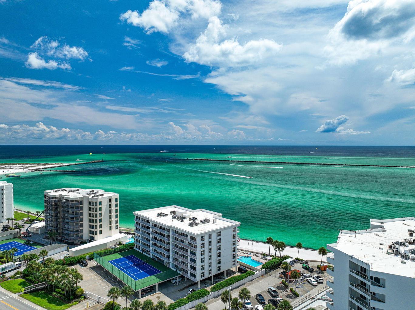 Experience breathtaking panoramic views of the Destin Harbor from every room in this beautifully appointed condo. Fully furnished and move-in ready featuring a stylish, chic interior complete with stainless steel appliances.  
A private 38' boat slip is included, (slip 7), which is located across the street.  Marina HOA fees are only $75 per month.  

Abundant natural light fills the space, creating a warm and inviting atmosphere perfect for both relaxation and entertaining.  

Residents of Waterview Towers enjoy exclusive access to a private beach along with premium amenities, including a beachfront pool and hot tub with views of Crab Island and the Destin Pass. Enjoy tennis and pickleball courts, a fitness center and an upcoming new grill area.  
 Come enjoy coastal living at its finest