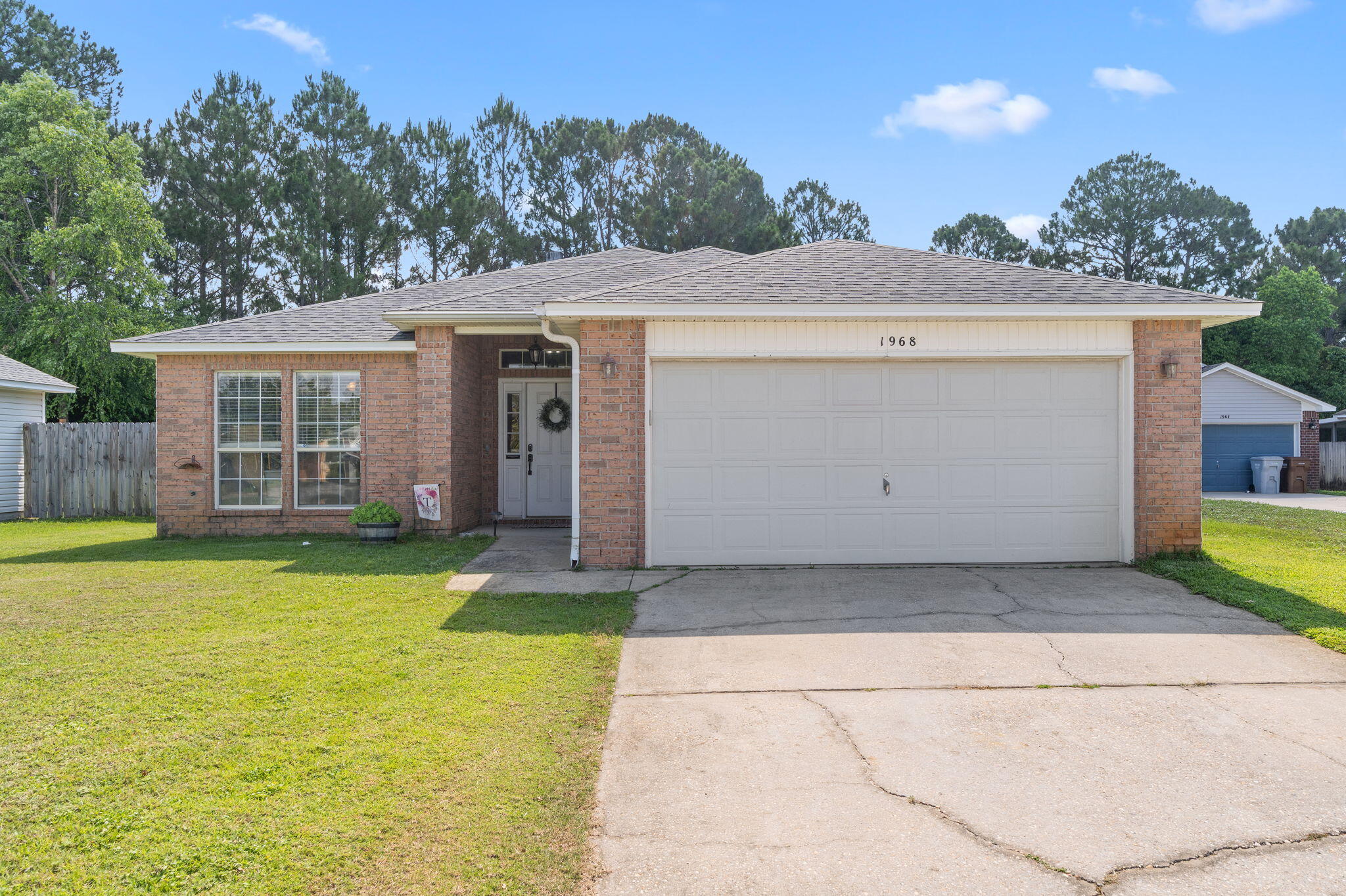 Welcome Home! This charming 3 bed, 2 bath, 2-car garage home in the Midway part of Gulf Breeze located in Hidden Shores offers 1857 sqft of comfort. Enjoy an open floor plan, vaulted ceilings, and a cozy fireplace. The kitchen features custom cabinets, granite countertops, tile backsplash, stainless steel appliances, and a wrap-around breakfast bar. Both the roof and water heater were replaced in 2021. Remodeled guest bath features a cultured marble shower/tub. Master suite boasts dual sinks, garden tub, separate shower, and a huge closet. Guest bedrooms have professionally shelved closets. Laundry room has custom cabinets. Relax on your covered patio in the large, privacy-fenced yard. This neighborhood also features underground utilities.  Don't miss this complete package!