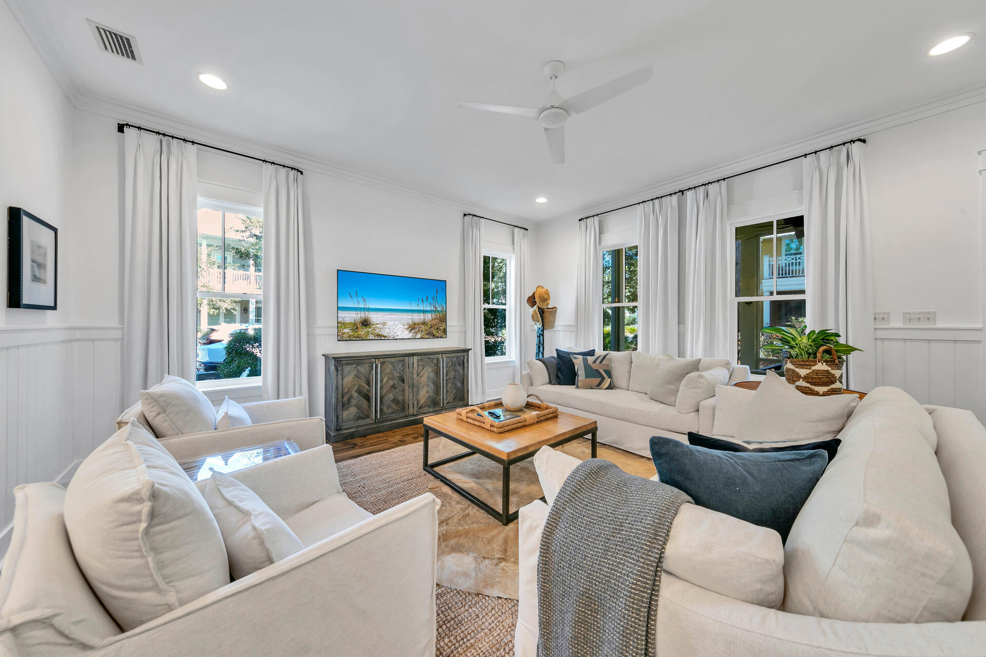 Welcome to 'Stay Salty', a beautifully updated five-bedroom, four-and-a-half-bath home located on a highly sought-after corner lot in the WaterColor community. Professionally designed by Three Dog Design and sold fully furnished with a four-person golf cart, this property comfortably sleeps 12 and has been extensively upgraded throughout. A true turnkey opportunity for luxury living or high-performing short-term rental ownership.
The open, light-filled floor plan features high ceilings and coastal-inspired interiors. The spacious living and dining areas flow into a custom kitchen with quartz countertops, stainless steel appliances, and a large island with seating. The main-level primary suite offers a spa-style bath, while upstairs includes additional king and queen suites, a double-queen room, a twin bunk nook, and a secondary living area with a private balcony.
Outdoor spaces include a screened patio with grill, covered front porch, upper balcony, and expansive side deck surrounded by mature landscaping. The home includes a garage suitable for the golf cart or a small vehicle, plus driveway parking for two vehicles.
Rental performance is exceptional, producing $130,508.05 in 2024, $158,259.47 for 2025, and $171,481.25 for 2026 (all gross revenue numbers excluding taxes collected) with new reservations coming in daily and lots of owner use! Over 60 five-star reviews across all OTA's and a 12% repeat guest rate year-to-date highlight its proven appeal.
Owners and guests enjoy full access to WaterColor's top-tier amenities including resort-style pools, tennis and pickleball courts, trails, parks, and the private WaterColor Beach Club. Just minutes from Seaside, 30A dining, and the Gulf, this corner-lot home combines design, comfort, and strong investment potential in one of 30A's most desirable neighborhoods.