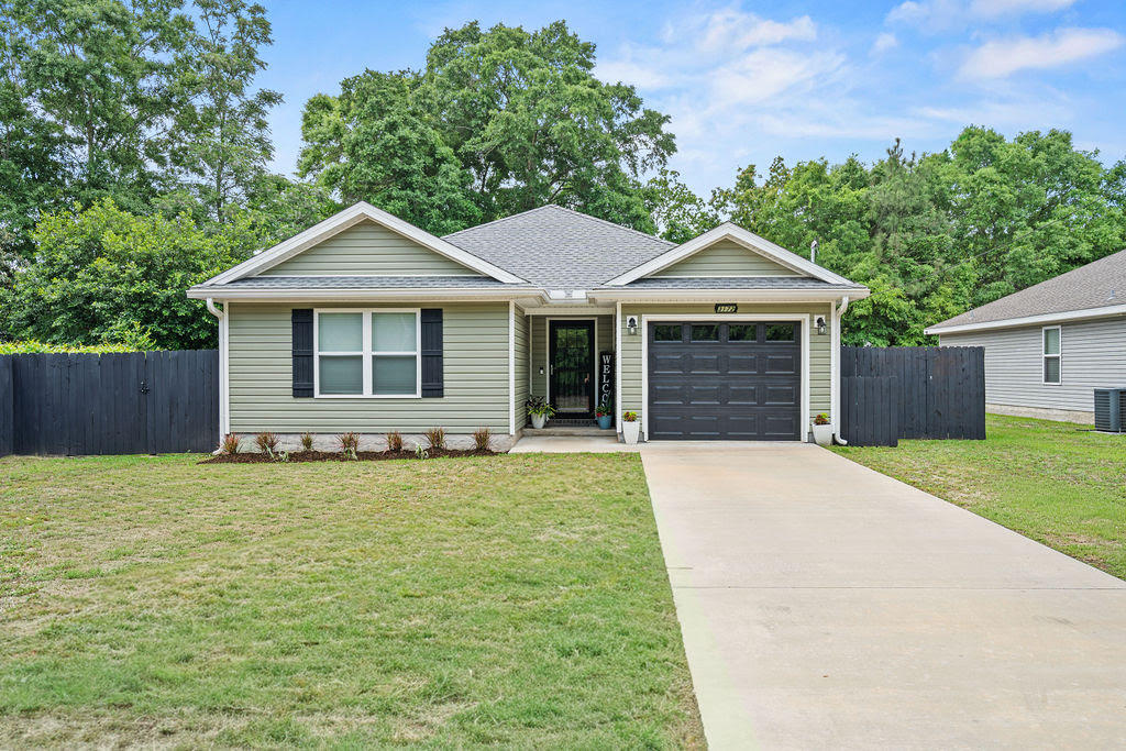 Why buy new construction and spend thousands more on upgrades when you can move right into a one-owner, like-new home that's already complete? Built in 2022 by a respected local builder, this beautifully maintained one-owner home offers everything buyers love about newer construction - PLUS all the upgrades that aren't included with many new builds. Enjoy a privacy-fenced backyard, gutters, storage building, extended patio, established landscaping, window treatments, refrigerator, washer & dryer and a spacious lot that's ready to enjoy from day one! All this and NO HOA! Inside, you'll find a bright open-concept floor plan with luxury vinyl plank flooring throughout the main living areas, dark shaker-style cabinetry, stainless appliances, and a split-bedroom layout designed for comfortable everyday living. The neutral finishes and meticulous care make this home truly move-in ready. Step outside to a covered back porch overlooking the large fenced backyard with mature trees providing privacy that's hard to find in many newer neighborhoods. To make the move even easier, the seller is offering $7,500 toward the buyer's closing cost - a tremendous value for today's buyers. Skip the construction delays, skip the upgrade expenses, and move into a home that's already finished.
