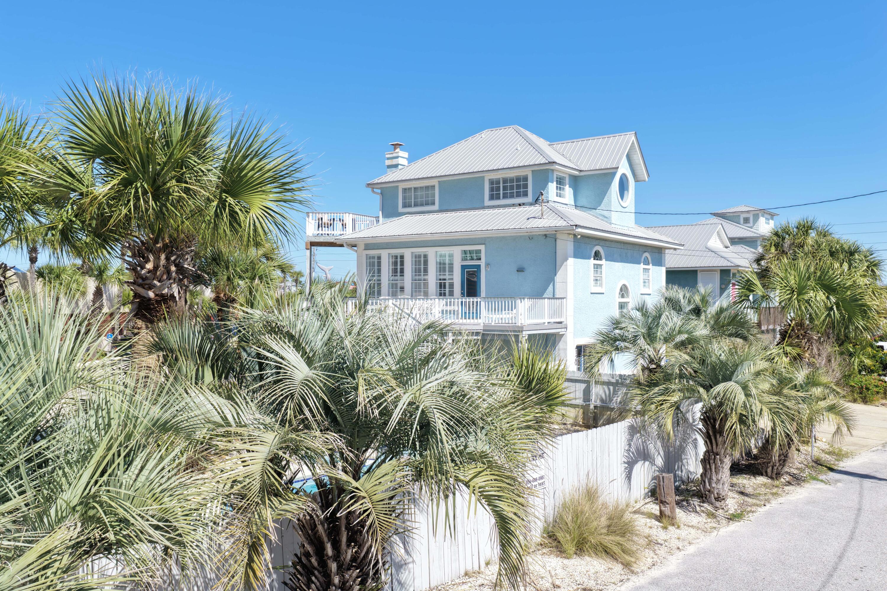 NEW PRICE AND MOTIVATED SELLER!  Fully- furnished, gulf-view home with private pool and literally just steps to the beach!  Situated on a private road with private beach access, this property offers a unique combination of privacy, convenience, and strong investment potential. This 4-bedroom, 3-bath home features a great layout for enjoying family and friends, an open kitchen, dining and living area, a 2nd living area located just off the pool, and an additional loft area that provides flexible space for guests or additional sleeping quarters. Enjoy gorgeous gulf views from your second and third stories, and a balcony on each level.  The second story balcony offers a spacious area with plenty of room to take in the breathtaking views and relax for family  meals, sunbathing, morning coffee, and evening sunsets.  The fenced backyard is designed for entertaining, and features a private pool and spa, pool deck, covered area to cool off in the shade, and grill space - this is the perfect spot to create new memories!  Ideally situated in Panama City Beach and within walking distance to local favorites including Finns, Liza's Kitchen, and Gypsea Crepes, as well as close to shopping, St Andrew's State Park, boating, and more.  Properties with these gulf views, private beach access, and private pool at this price point are extremely limited. Come make this your new primary residence, second home, or SHORT-TERM RENTAL INVESTMENT!  Schedule your private showing today!