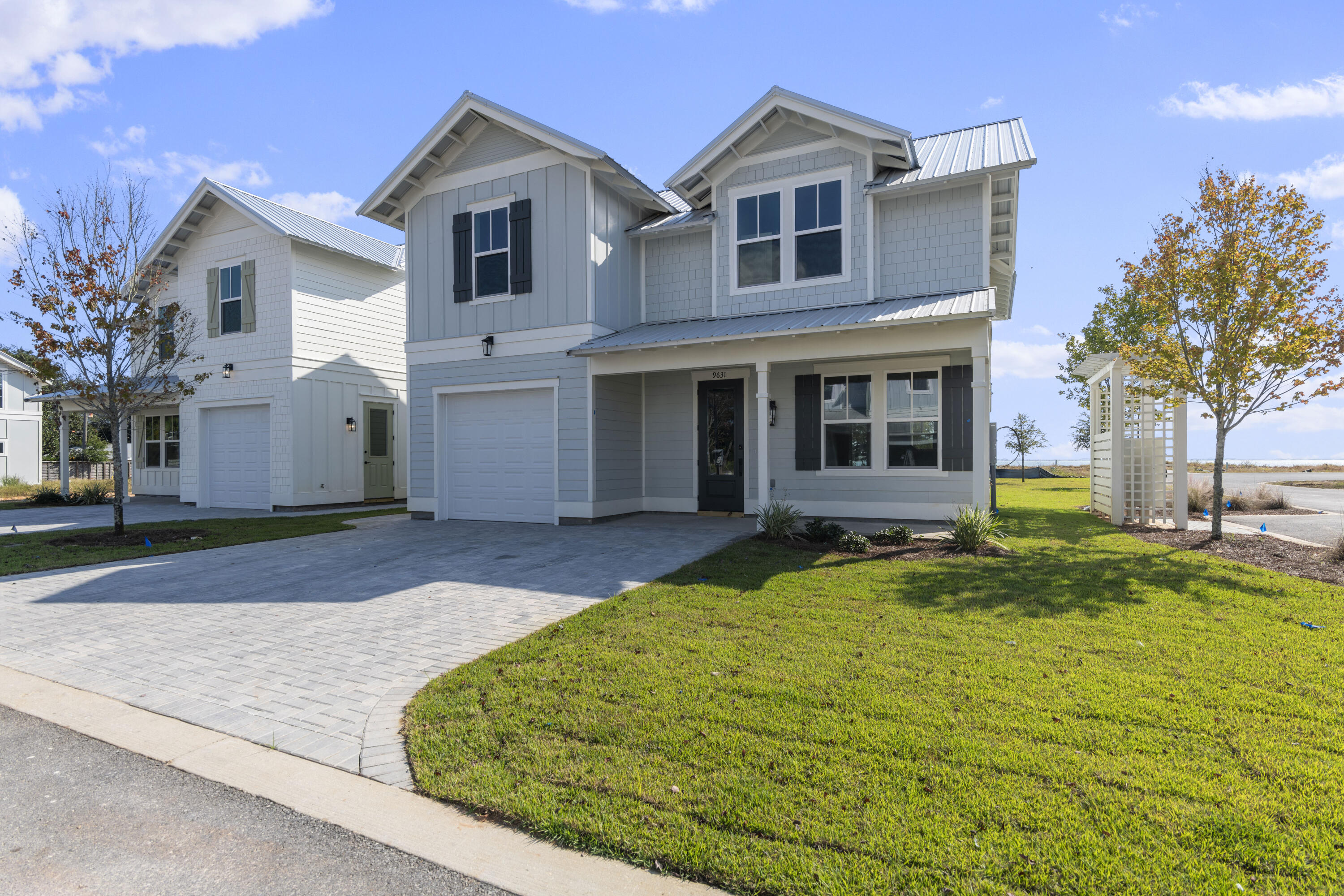 Completed construction with Seller Financing available with competitive terms!! Welcome to your dream oasis, where everyday feels like a vacation & everything you need is right in this location. Nestled in an exclusive, newly developed waterfront community, this 4-bedroom, 4.5-bath home (with bonus area) offers the perfect blend of luxury, tranquility, and modern convenience. Imagine waking up to serene water views (from your first floor primary suite), enjoying your morning coffee while watching the gentle ripples of the Santa Rosa Sound, and stepping out onto the community dock to hop on your boat for a quick cruise or sunset sail. With 9 private slips just steps from your door, boating enthusiasts will find paradise at their fingertips.

This is more than just a home, it's a lifestyle. Spend your days lounging by the water, walking along our pristine beaches just minutes away, or exploring all Navarre's growth has to offer. Live where others dream of vacationing, an angler's paradise, water sports haven, and a sun lover's refuge. Welcome to your forever home, where the sky meets the sea, and every day is an opportunity to indulge in the ultimate coastal lifestyle alongside your modern everyday needs.

Prices, plans, features & options are subject to change. (New homes feature a single sink in upstairs bath just off bonus area). Sq footage is approx. Artist renderings, photos, colors, features & sizes are for illustration purposes only & may vary from the home as built.