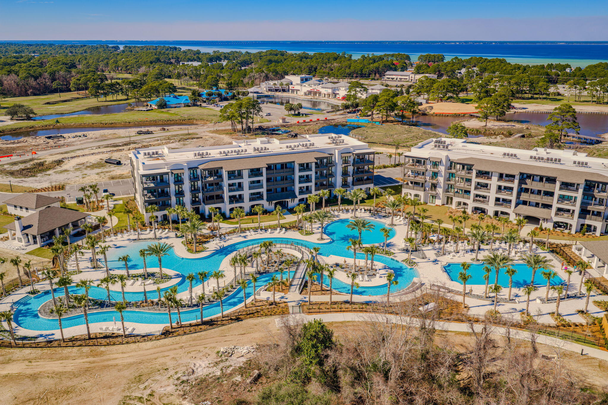 Luxury Coastal Living at The Grove at Seascape - Brand New Resort Condo with Private Beach Access

Welcome to The Grove at Seascape, a stunning new Mediterranean-inspired condominium development nestled inside the exclusive Seascape Golf, Beach & Tennis Resort in Miramar Beach, Florida. This gated, resort-style community offers an unmatched blend of luxury, comfort, and lifestyle--just steps away from 2,000 feet of private beach along the Emerald Coast.

This spacious 2-bedroom + custom-built bunk room condo offers the perfect mix of modern elegance and coastal charm. Every detail has been thoughtfully designed, from the 10-foot ceilings and recessed lighting to the porcelain tile and luxury vinyl plank flooring throughout. Read more.... Interior Features

This stunning residence is thoughtfully designed with white quartz countertops and matching backsplash, creating a sleek and timeless kitchen aesthetic. The kitchen also features white shaker-style soft-close cabinetry, paired with premium stainless steel Bosch appliances, including a high-performance gas rangeperfect for the home chef.

The condo offers oversized bedrooms, each equipped with large walk-in closets that provide ample storage and organization. A custom-built bunk room adds a rare and valuable touch, ideal for families or hosting guests.

The spa-inspired primary bathroom invites relaxation with a deep soaking tub, designed to bring the feel of a luxury retreat into your everyday life. The open-concept living and dining area is ideal for entertaining, offering both style and functionality.

Step outside to enjoy breathtaking views overlooking either the Aquatic Garden amenitieswhich include a lazy river, zero-entry family pool, social pool, and beautifully landscaped green spacesor relax with scenic vistas of the event lawn and open-air pavilions.

Resort Amenities

Residents of The Grove at Seascape enjoy access to 2,000 feet of private beach, offering direct entry to the sugar-white sands and turquoise waters of the Gulf.

The resort features multiple resort-style pools, including a lazy river, sun decks, and zero-entry pools perfect for lounging or family fun. Enjoy the comfort of open-air pavilions, outdoor TVs, bathhouses, and a children's playground, all designed to enhance your beach lifestyle.

The event lawn provides space for lawn games, live entertainment, and community gatherings, while on-site restaurants, bars, and convenient food and beverage delivery services offer exceptional dining and refreshment options without ever leaving the property.

Additional amenities include live music and concerts, family-friendly entertainment options, golf and tennis facilities, water sports, and beautifully maintained parks.

To ensure convenience and peace of mind, residents benefit from on-site housekeeping, building maintenance, and 24/7 gated security, all supported by concierge-style service.

At Seascape Resort, luxury extends well beyond your front door. Whether you're seeking a peaceful personal retreat or a high-performing investment property, The Grove offers an unparalleled coastal lifestyle that blends elegance, comfort, and world-class amenities. This is the ONE!