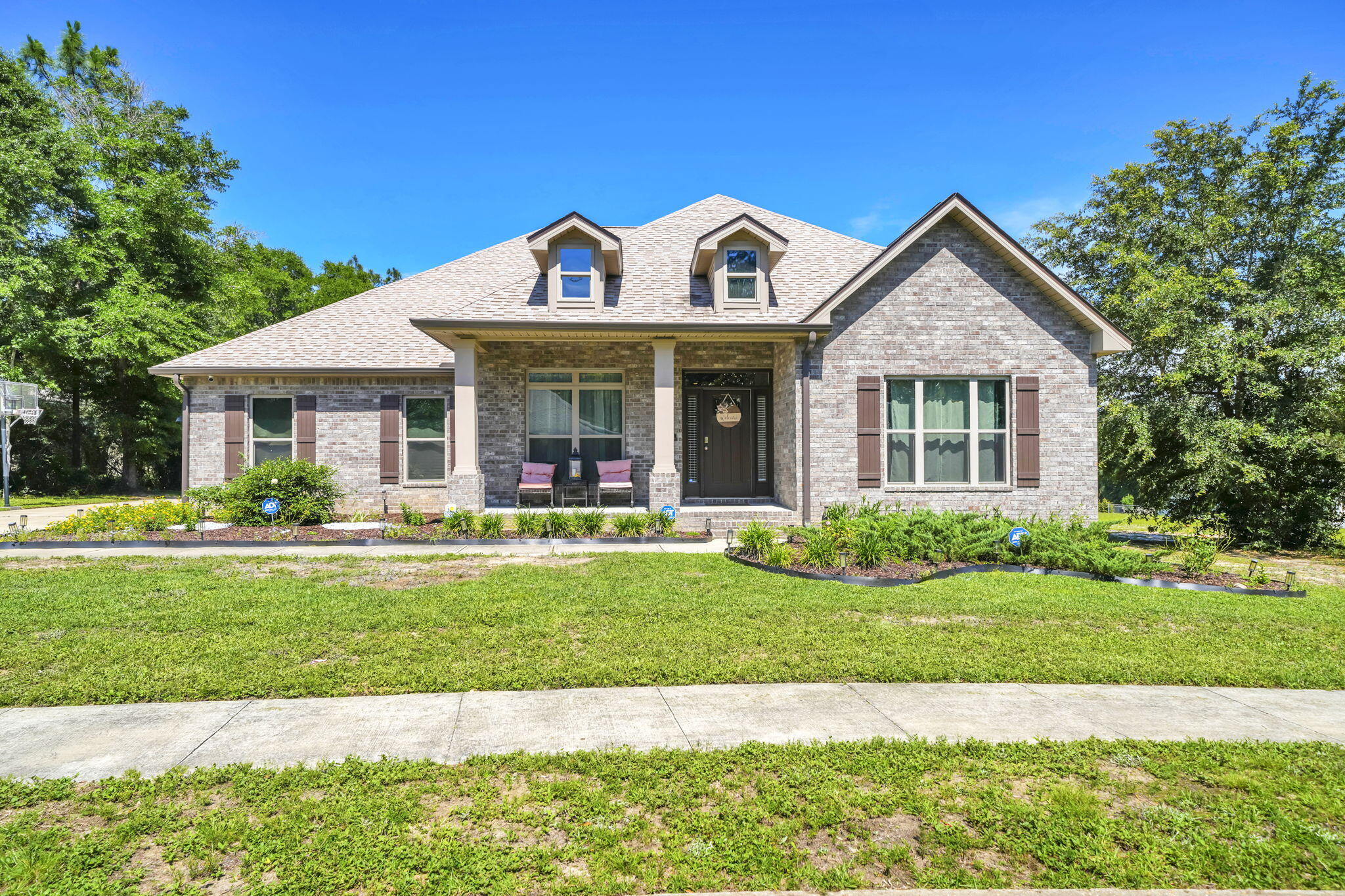 ***OPEN HOUSE! Sunday, June 14, 2PM-4PM*** Welcome to 6001 Fiori Drive in the beautiful Camellia Cove community. Situated on a spacious 0.66-acre corner lot, this highly desirable 'McKenzie' floor plan home offers 5 bedrooms, 3 bathrooms, and 3,186 square feet of thoughtfully designed living space. Spacious single-story living and newer construction! 

Designed for both everyday living and entertaining, the open-concept floor plan features luxury vinyl plank flooring, tray ceilings, crown molding, a formal dining room, dedicated office/flex space, and a spacious living area filled with natural light. The kitchen is equipped with granite countertops, stainless steel appliances, a walk-in pantry with wood shelves, and abundant cabinet space. 

The split-bedroom layout provides privacy for the primary suite while four additional bedrooms offer flexibility for guests, hobbies, or remote work. The closets have been enhanced with organized storage shelves. Head outside to the covered back patio overlooking the HUGE fenced backyard, offering plenty of room for outdoor enjoyment and for a future pool. Another highlight is the gated side access and space for ample parking, providing room for multiple vehicles, boat, and recreational equipment. Located near various shopping, dining, and the North Crestview Publix corridor, this home combines convenience, space, and modern finishes in one of Crestview's most desirable newer communities.