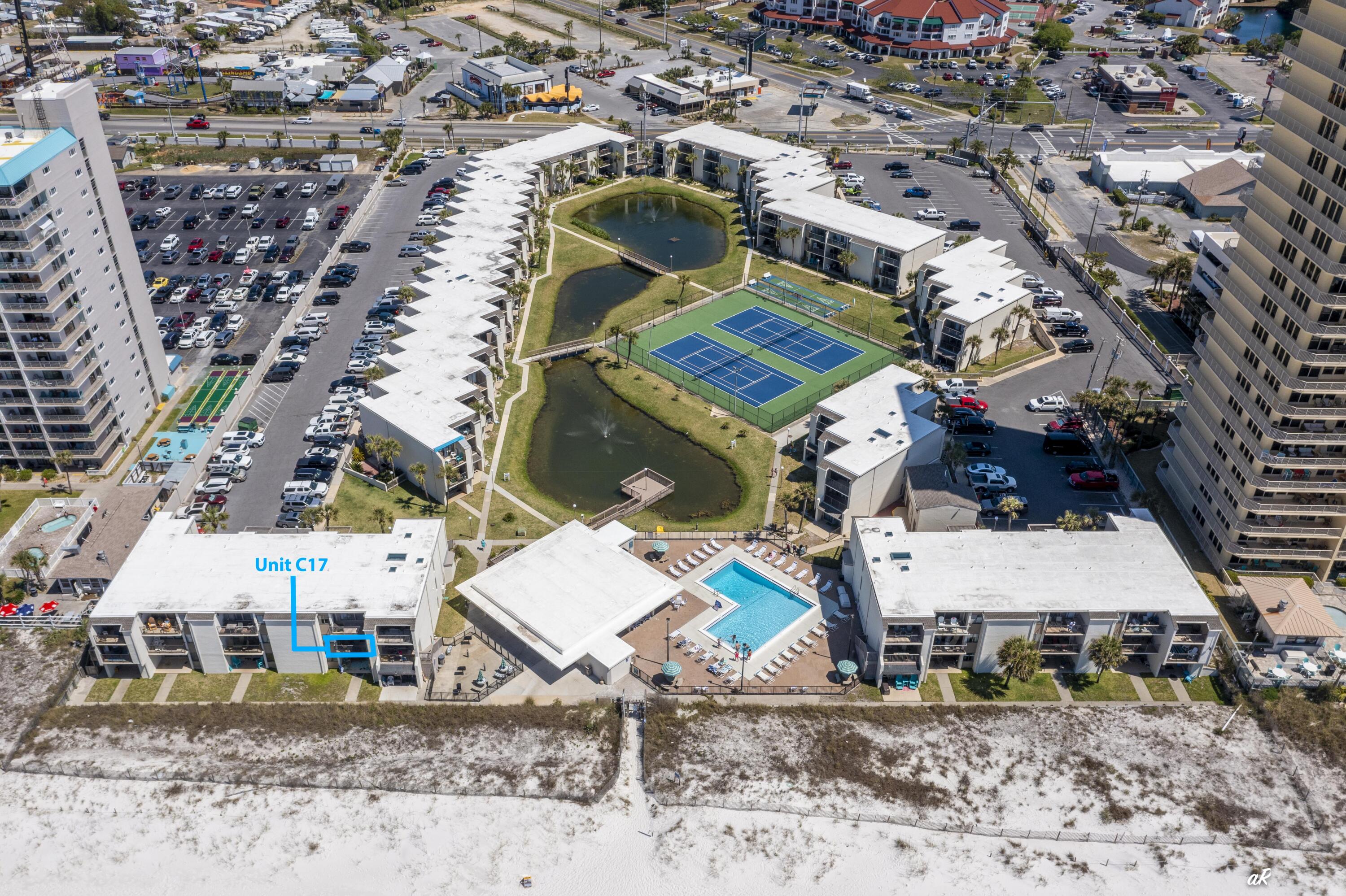 GULF FRONT @ Sugar Beach!! Presenting Sugar Beach C-17, the only gulf-front condo currently available in this highly desirable gated resort. This beautifully positioned 2-bedroom, 2-bath residence delivers the true Gulf-of-Mexico lifestyle, with both the primary suite and the spacious family room overlooking the water and offering direct balcony access for sunrise coffees, sunset dinners, and the sound of waves all day long. Inside, the condo features tasteful updates including real wood cabinets, granite countertops, stainless steel appliances, and tile flooring throughout, giving the entire space a clean, coastal feel that stands up well to beach living. Located on the coveted East End of Panama City Beach, Sugar Beach places you just minutes from St. Andrews State Park, Pier Park, and a wide selection of restaurants, live-music venues, shopping, watersports, and both day- and night-life attractions. Within the gates, owners enjoy private beach access, a community pool, clubhouse, tennis and shuffleboard courts, and beautifully maintained lake and walking areas. This unique gulf-front opportunity combines unbeatable views, strong amenities, modern improvements, and the added privacy of a gated communitySugar Beach C-17 delivers the lifestyle buyers come to Panama City Beach to find.