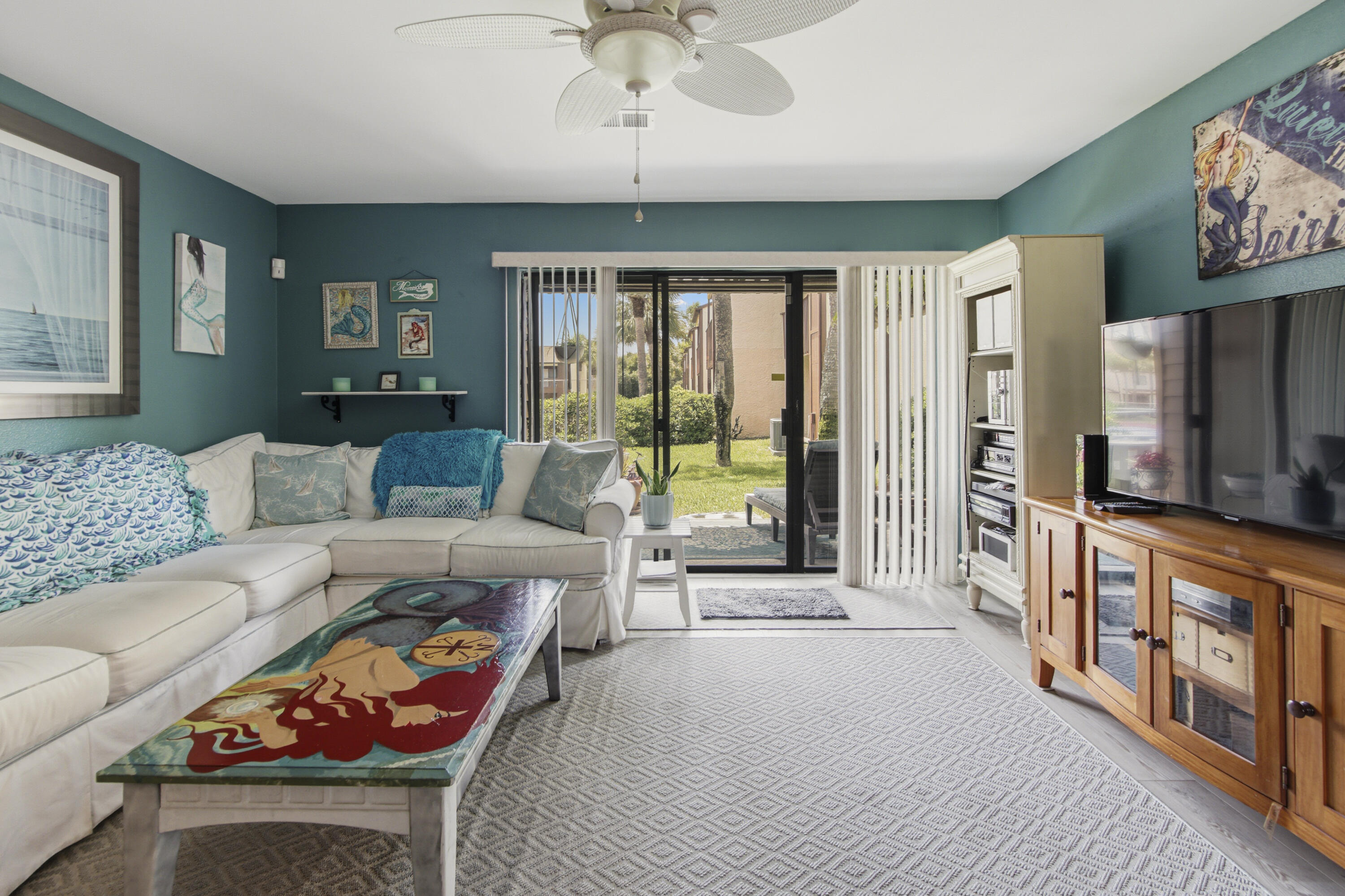 Welcome to Beachwalk Condominium! Truly one of Panama City Beach's best-kept secrets--tucked away on the desirable west end,  named for its private walkover bridge leading straight to the sugary-white sand beaches & Emerald Coastline.   Open concept, well taken care of unit has been a primary residence.  Hot water heater 2019.  AC 2018 replaced as well as all duct work.  Roof replaced 2025.  Flooring replaced to vinyl plank flooring.  White custom cabinets with stainless pulls, gas stove, stainless appliances  and tastefully painted.  Beachwalk Resort amenities:  Pool, tennis  & shuffleboard courts.  Just a few minutes to the sugary white sand beaches and emerald coastline.  Conveniently located  to Pier Park shopping, dining and entertainment.  Easy access to the airport, 30 A shopping & dining and a short drive to Destin outlet malls.  Seller would be interested in renting unit as a long term lease post closing if new owner is interested.  Don't miss out on this lovely unit.