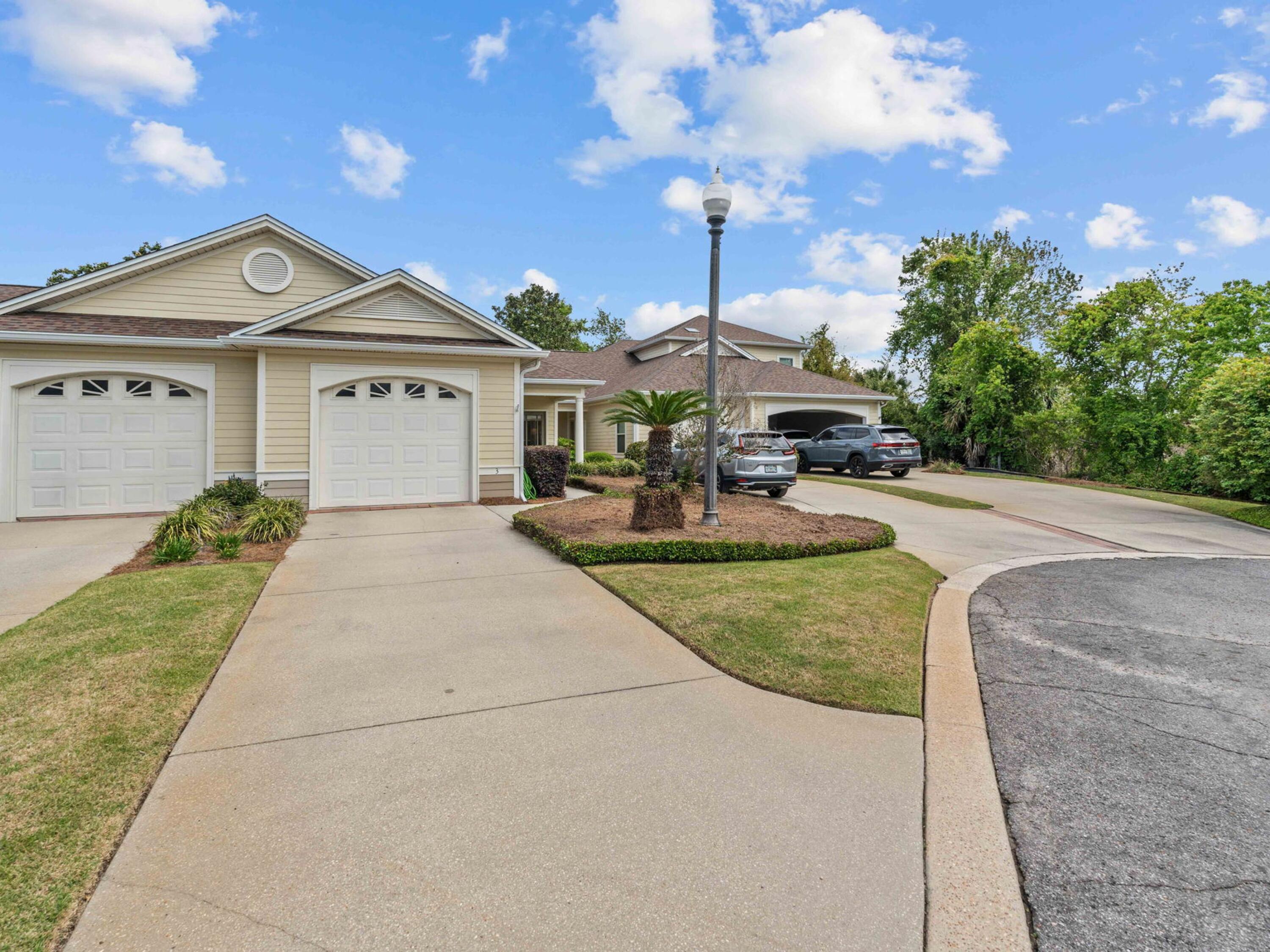 The Oaks Plantation is an exclusive gated community of just 30 townhomes, beautifully landscaped, professionally maintained and perfectly situated near Pretty Bayou and Historic St. Andrews. This single-story home is two bedrooms and two bathrooms and features a covered front porch, grand entry, nine-foot ceilings, crown molding, and ceramic tile in the entry, kitchen, laundry, and baths. The kitchen includes GE and Whirlpool appliances. The living area has a tray ceiling and opens to a private screened patio overlooking a picturesque pond and wooded area. The primary bedroom includes an adjoining sitting room, two closets, full bathroom with double vanities and direct access to the screened porch. There is ample parking including a single-carattached garage, driveway spots plus an additional dedicated parking spot for this property. This property is low maintenance, and the HOA covers theexterior maintenance, insurance, landscaping, gate, and termite bond. Don't miss this opportunity!