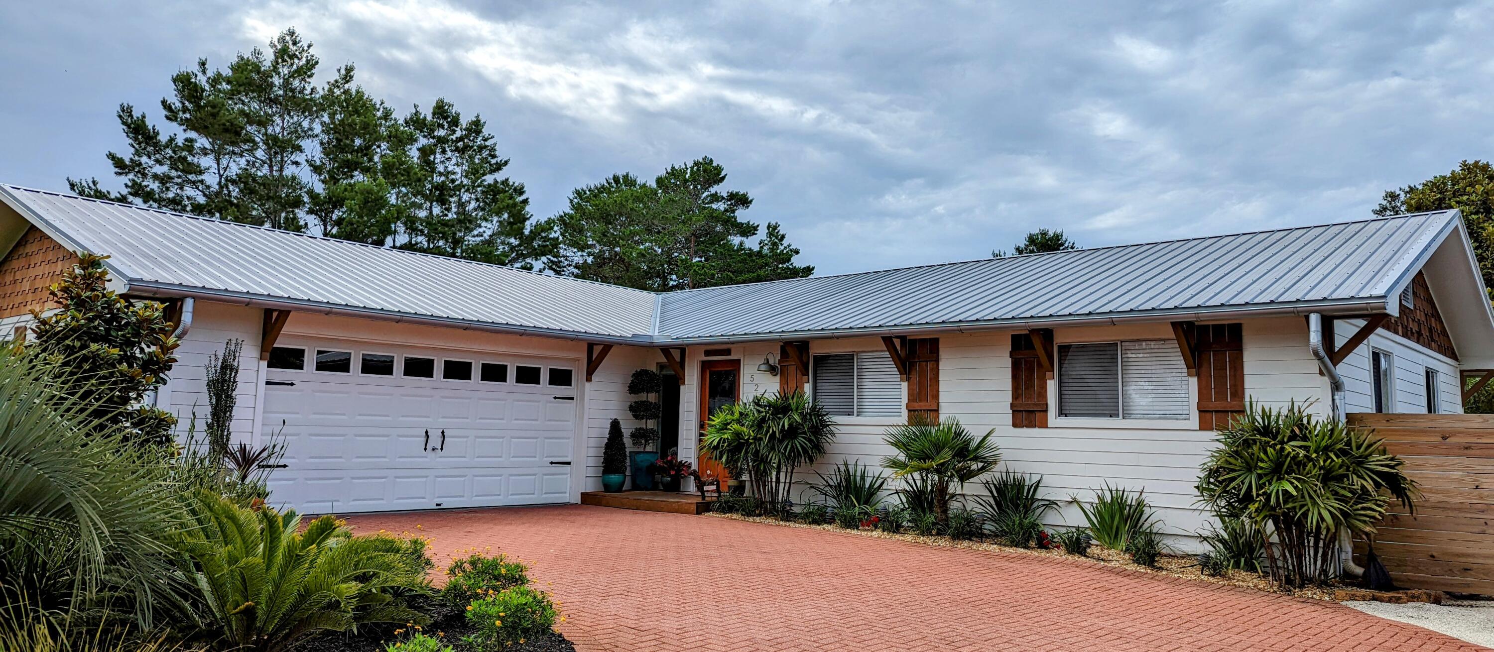 PRICED BELOW RECENT APPRAISAL!  Beautifully renovated beach home with in-law suite on 1/3 ACRE in the sought after neighborhood of Santa Rosa Ridge, only 1  mile from beach access and all that Gulf Place has to offer. If you're looking for a full-time residence or a second home, this is the one! Home boasts upgraded features such as shiplap throughout, tiled floor, quartz  countertops, stainless steel appliances, 8 ft kitchen island with hood, separate laundry/pantry/mudroom, & barn doors throughout just to name a few. Enormous yard is a clean slate with endless possibilities to add a beautiful pool and outdoor kitchen or add on to the current 16x16 deck. If you're a nature lover or love gardening, you'll love the greenhouse! Side yard accommodates an RV w/elec hookup already installed. No flood ins req'd!