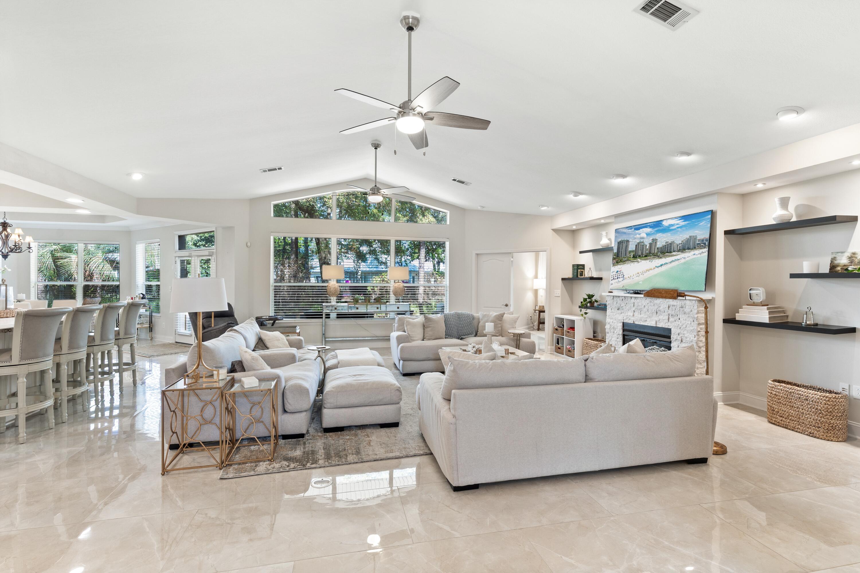 Don't miss out on a rare opportunity to own a beautifully updated home in Sandestin Golf & Beach Resort, this impressive 4-bedroom, 3.5-bath residence offers over 3,300 square feet of refined living on the highly sought-after Baytowne Circle East.

Completely refreshed in 2021, the home welcomes you with a dramatic entry featuring marble-inspired porcelain flooring, elegant architectural columns, and decorative glass double doors beneath a grand arched transom, allowing natural light to pour into the space.

Designed for both everyday comfort and effortless entertaining, the chef's kitchen showcases custom shaker cabinetry with crown molding, premium quartz countertops, stainless steel appliances, designer lighting, and an oversized island that opens seamlessly to the expansive living area.

The grand living room is highlighted by soaring ceilings, large windows, recessed LED lighting, and a striking stone fireplace with custom floating shelves, creating a bright and inviting focal point for gatherings.

The private primary suite serves as a tranquil retreat, offering generous space for a sitting area and direct access to the outdoor patio, perfect for enjoying the serene surroundings. The spa-inspired primary bath features a quartz double vanity, soaking tub, and frameless glass walk-in shower with designer tile and rainfall fixtures, along with a spacious custom walk-in closet.

One of the guest bedrooms functions as a second private suite, ideal for visiting guests or extended family, while the additional bedroom offers comfort and privacy with its own well-appointed bath. A dramatic designer powder room with statement marble wall detailing adds a sophisticated touch for entertaining. The 4th bedroom was converted to the Office/ Laundry room. Plumbing exists in the linen closet for stackable washer/dryer to convert room back to bedroom. 

Thoughtfully renovated with quality finishes and timeless design, this turnkey residence offers the comfort of modern living within one of the Gulf Coast's most sought-after resort communities. From the dramatic architectural entry to the spacious entertaining areas and private suite accommodations, every detail has been designed to create a home that feels both elegant and welcoming. Whether enjoyed as a primary residence or a luxurious coastal retreat, this exceptional property represents a rare opportunity to experience the best of Sandestin's renowned resort lifestyle.

An exceptional home offering privacy, elegance, and resort living in the Baytowne Avenue neighborhood, one of Northwest Florida's most desirable communities.