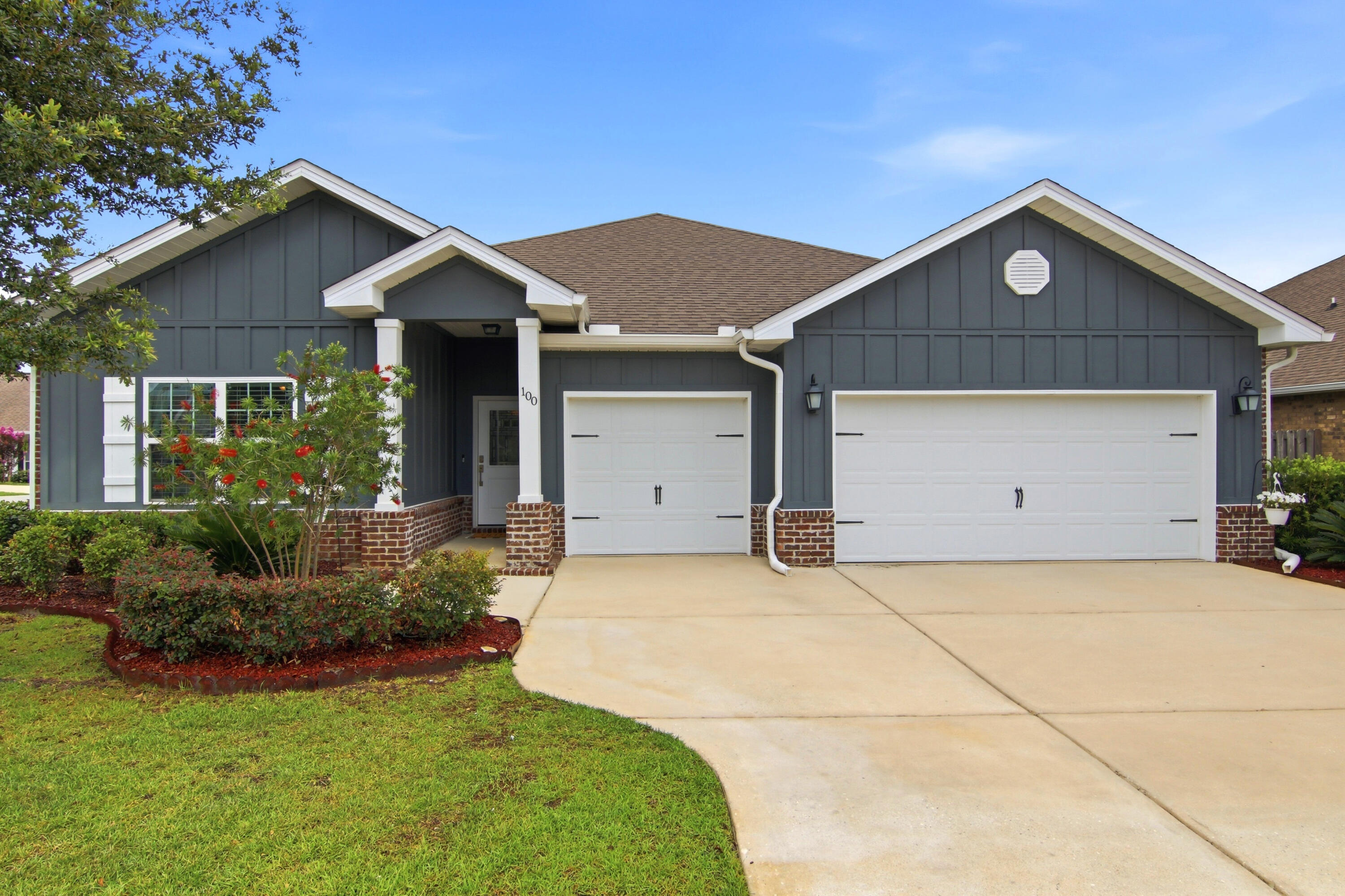 Welcome to 100 Norwich Rd, a beautifully enhanced residence in the desirable neighborhood of Central Park within Hammock Bay. This Camden floor plan home consists of 2785 sq ft with 4 bedrooms plus a flex room for in-laws,  guests, or a teenager's suite.   The three-car garage offers additional space for your golf cart, bikes, or extra storage space.  Showcasing over $25,000 in thoughtful upgrades, this home offers the perfect blend of style, modern convenience, and the exceptional lifestyle that has made Hammock Bay one of Northwest Florida's most sought-after communities. 

From the moment you arrive, you'll appreciate the attention to detail that sets this home apart. A stunning new front door creates an inviting first impression, while beautifully designed landscaping enhances the home's curb appeal and welcoming atmosphere. 

Inside, newly laid upgraded LVP flooring and abundant natural light create a warm and sophisticated living environment. The kitchen serves as the heart of the home, featuring a designer brick backsplash that adds texture, character, and timeless appeal. Upgraded lighting and ceiling fans are present throughout the home and complement the tray ceilings in the living room and primary suite.  The large primary suite at the back of the house offers garden views creating a relaxing retreat.  The primary bath is highlighted by a completely tiled shower and access to a walk-in closet. The screened-in porch creates a private space for morning coffee and evening relaxation. The backyard offers safety for kids and pets by being completely fenced. The in-ground irrigation system is supplied by a private well, keeping your lawn healthy and happy without the additional cost. 

Practical upgrades add long-term value and peace of mind, including full-house gutters, termite bait stations, and convenient garage attic stairs that provide easy access to additional storage space. Along with overlay shelving in the pantry and linen closets, maximizing organization and functionality.  Quality blinds throughout the home provide a polished finishing touch. 

Beyond the home itself, residents enjoy all the amenities of Hammock Bay, including resort-style zero entry pools, fitness facilities, sports courts, walking and biking trails, parks, and community gathering spaces. Just minutes away, the world-famous beaches of the Emerald Coast offer endless opportunities for recreation and relaxation.