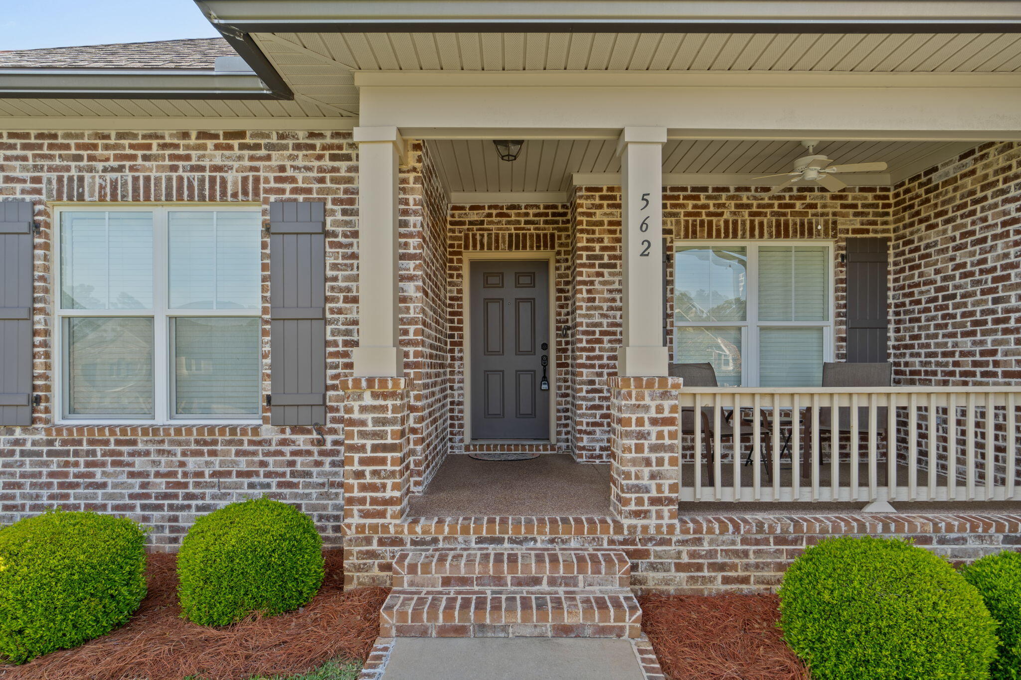 Immaculate, one-owner home in Hawk's Landing that truly shows like a model. Built in 2013 by Randy Wise and meticulously maintained, this 3 bedroom, 2.5 bathroom home with a dedicated office or bonus space offers 2,078 square feet of thoughtfully designed living space on a beautifully landscaped 0.3 acre lot. From the moment you arrive, the curb appeal stands out with a clean, well-manicured lawn and pristine exterior. Inside, the home features an open and functional layout with tile flooring throughout the main living areas, crown molding, and 9-foot ceilings that create a spacious, upscale feel. The kitchen is the heart of the home, complete with granite countertops, a large center island, breakfast bar seating, stainless steel appliances, and custom Legacy cabinetry. It flows seamlessly into the main living area, making it perfect for both everyday living and entertaining. The split floor plan offers privacy, with a spacious primary suite featuring a double vanity, granite countertops, soaking tub, and separate shower. Additional bedrooms are generously sized, and the office or flex space provides the perfect setup for working from home or a playroom. Step outside to a covered and screened rear porch overlooking a beautifully maintained backyard with upgraded landscaping and a retaining wall, creating a private and peaceful outdoor space. Additional features include high-impact windows, 2x6 exterior wall construction, R-19 insulation, Mana-Bloc plumbing system, sprinkler system on timer, and an oversized garage with finished flooring. This home is the definition of move-in ready. Every detail has been cared for, making it a rare find in today's market.