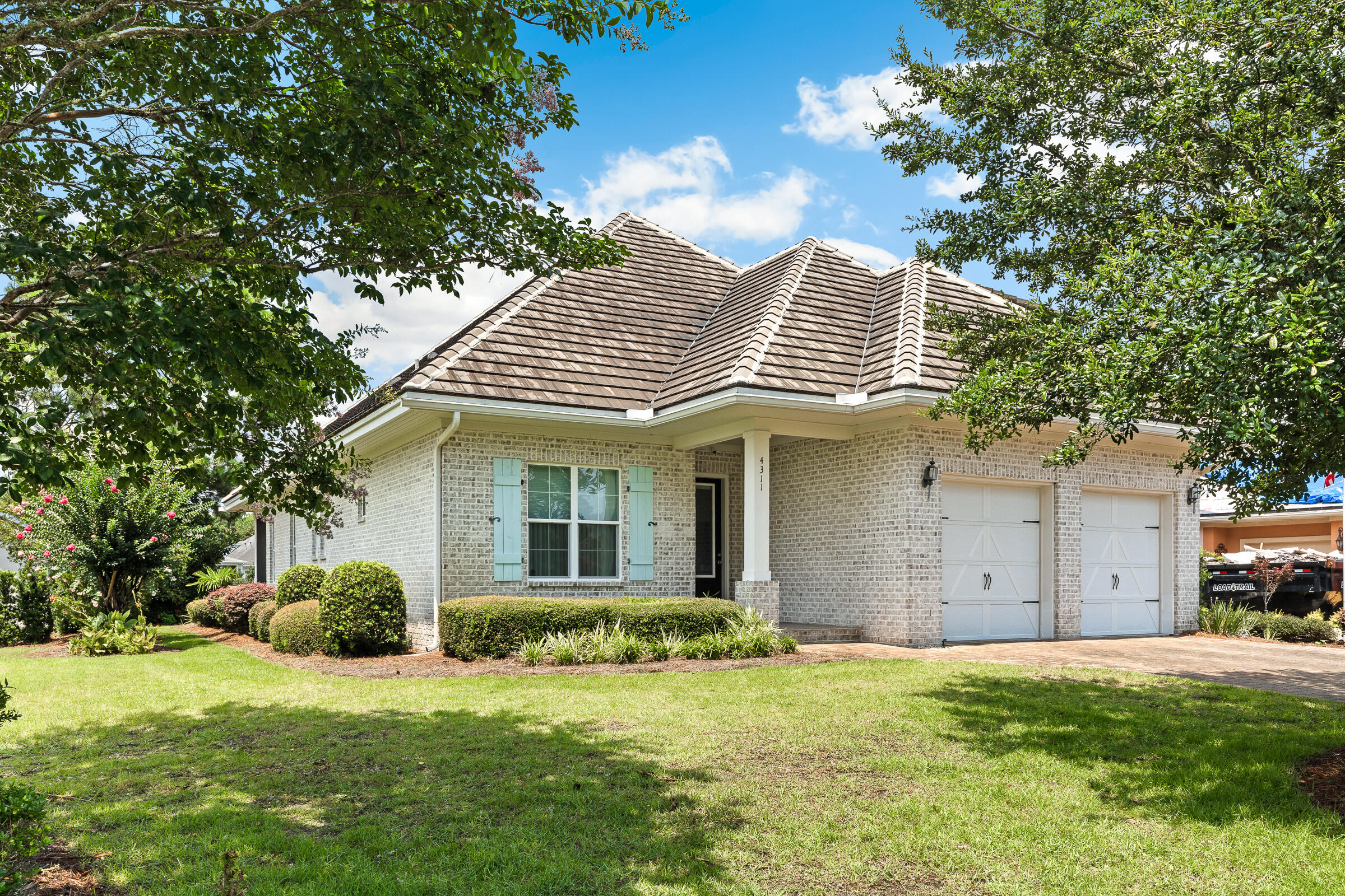 Welcome to luxury living in the prestigious gated golf course community of Kelly Plantation. This beautifully updated newer home offers an exceptional blend of elegance, comfort, and functionality in one of Destin's most sought-after neighborhoods. Designed for both everyday living and effortless entertaining, the spacious open floor plan features a chef's kitchen with high-end appliances, a large center island, beautiful wood flooring, and seamless flow into the living and dining areas. The screened porch provides the perfect setting to relax and enjoy peaceful lake views. The thoughtfully designed layout includes a spacious primary suite and two additional bedrooms on the main level, offering convenient single-level living. The luxurious primary retreat features separate his-and-her closets with custom built-ins and a spa-inspired bath complete with dual vanities, a large garden tub, and an oversized walk-in shower. A downstairs guest bath includes a walk-in soaking tub with therapeutic jets, providing both comfort and accessibility. Upstairs, a welcoming loft leads to an impressive media room equipped with surround sound, projector hookup capabilities, and a large adjoining storage closet. One additional guest bedroom and a full bath complete the second level, offering plenty of space for family and visitors. Built for lasting beauty and low maintenance, the home features an all-brick exterior, a durable concrete tile roof, and energy-efficient blown-in attic insulation. Residents of Kelly Plantation enjoy world-class amenities, including a championship golf course, clay tennis courts, pickleball courts, a fitness center, walking trails, and beautifully maintained grounds. This exceptional lakefront home combines luxury, quality craftsmanship, and an unparalleled lifestyle in one of the Emerald Coast's premier gated communities. It is conveniently located to wonderful restaurants, shopping, and water activities, including boating and the beautiful Emerald Coast beaches!