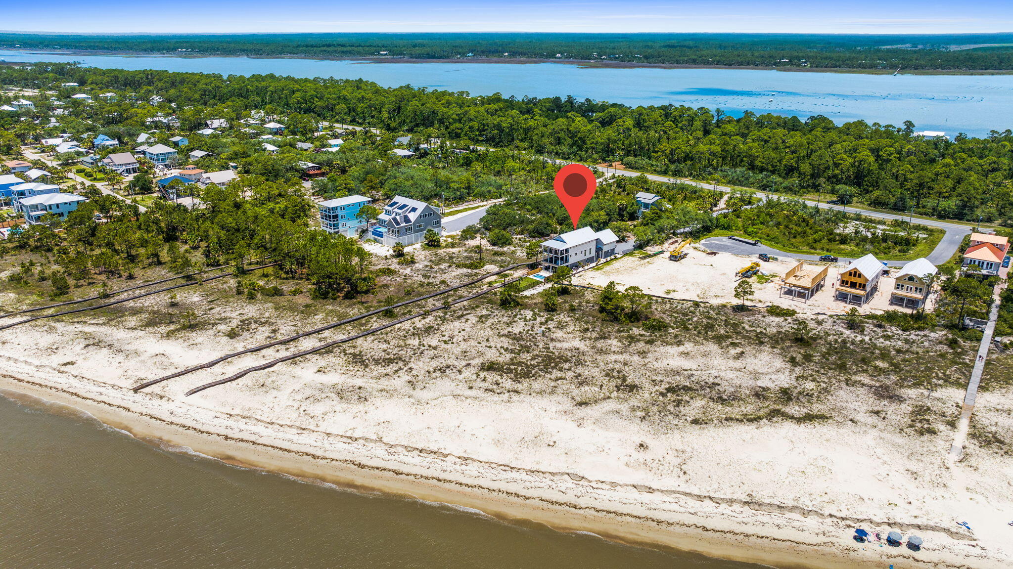 Lifestyle: Start the morning on the local golf course at St. Joseph Bay, spend the afternoon eating lunch in downtown Port St. Joe, midday barefoot on your beach, and the evening poolside under the stars(s'mores are optional). This home delivers a full coastal way of life with privacy and space that's increasingly hard to find. A rare combination on the Forgotten Coast: Gulf-front 1.1 acres, private beach and pool--all in one extraordinary property. 5 Bedrooms | 4.5 Baths • Separate guest living quarters with full kitchen and bedroom. This is a true resort lifestyle. Ideal for primary living, second home, or luxury coastal retreat. You must come experience.