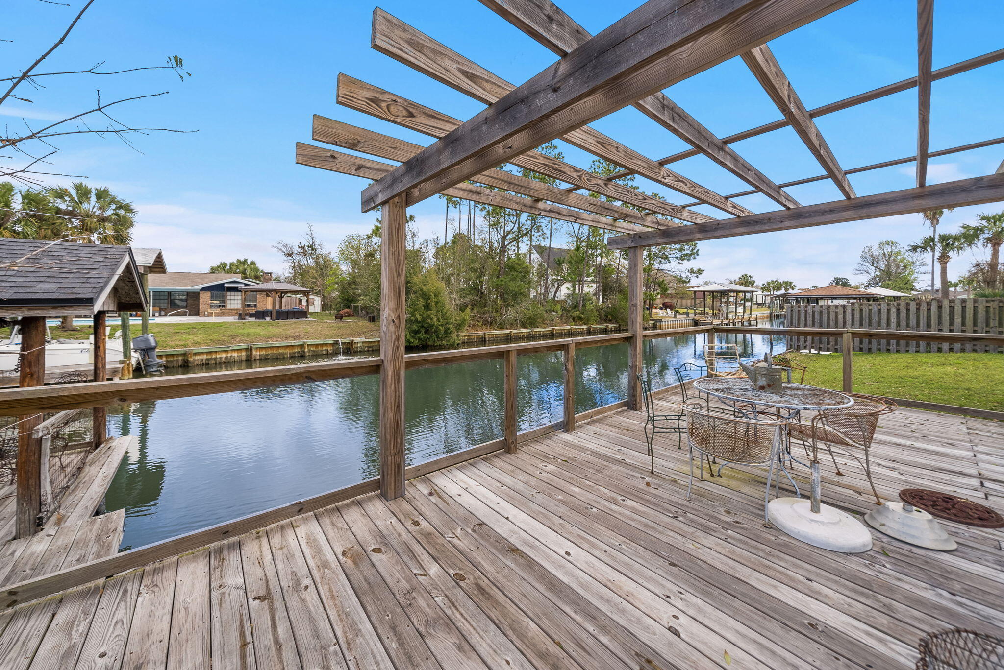 One level. One Owner. Built to be lived in and loved for generations. This WATERFRONT OPPORTUNITY now offers a brighter, more inviting feel. The interior and exterior enhancements complements the home's true coastal culture with a private pool, canal frontage, and a covered dock--perfect for fishing, boating, and unwinding by the water. Pack your picnic and head over to Shell Island. The residence features 4 bedrooms and 2.5 baths, including a flex room conveniently located just inside the entry from the drive-through garage, opening on both sides to create a porte-cochère style arrival and exit. No HOA
This NorthShore waterfront home is ready for its next chapter and offers an exceptional opportunity along the Emerald Coast.
