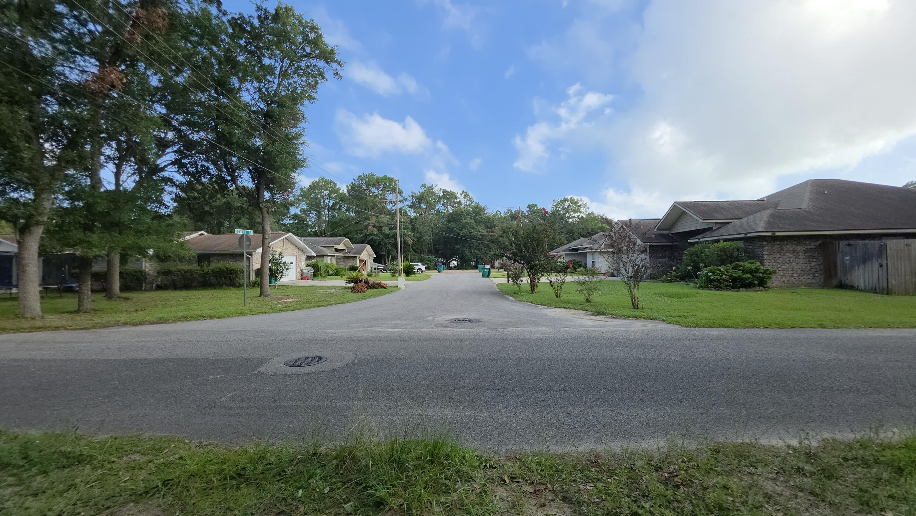 Buildable lot near the Eglin AFB back gate, Fort Walton Beach, in the Wright neighborhood. 0.2 acres, zoned residential single family, no HOA, no deed restrictions.

Mature tree canopy, quiet street, close enough to hear the jets on approach and far enough to still enjoy your coffee in peace.

Lots of newer builds and full renovations in the area; older part of town being slowly updated.

The structure on site may have already flown its last mission. Today the value's in the dirt, not the roof. Buyer to confirm demolition and new build requirements with the county.

Electric, public water, and public sewer already run to the lot.