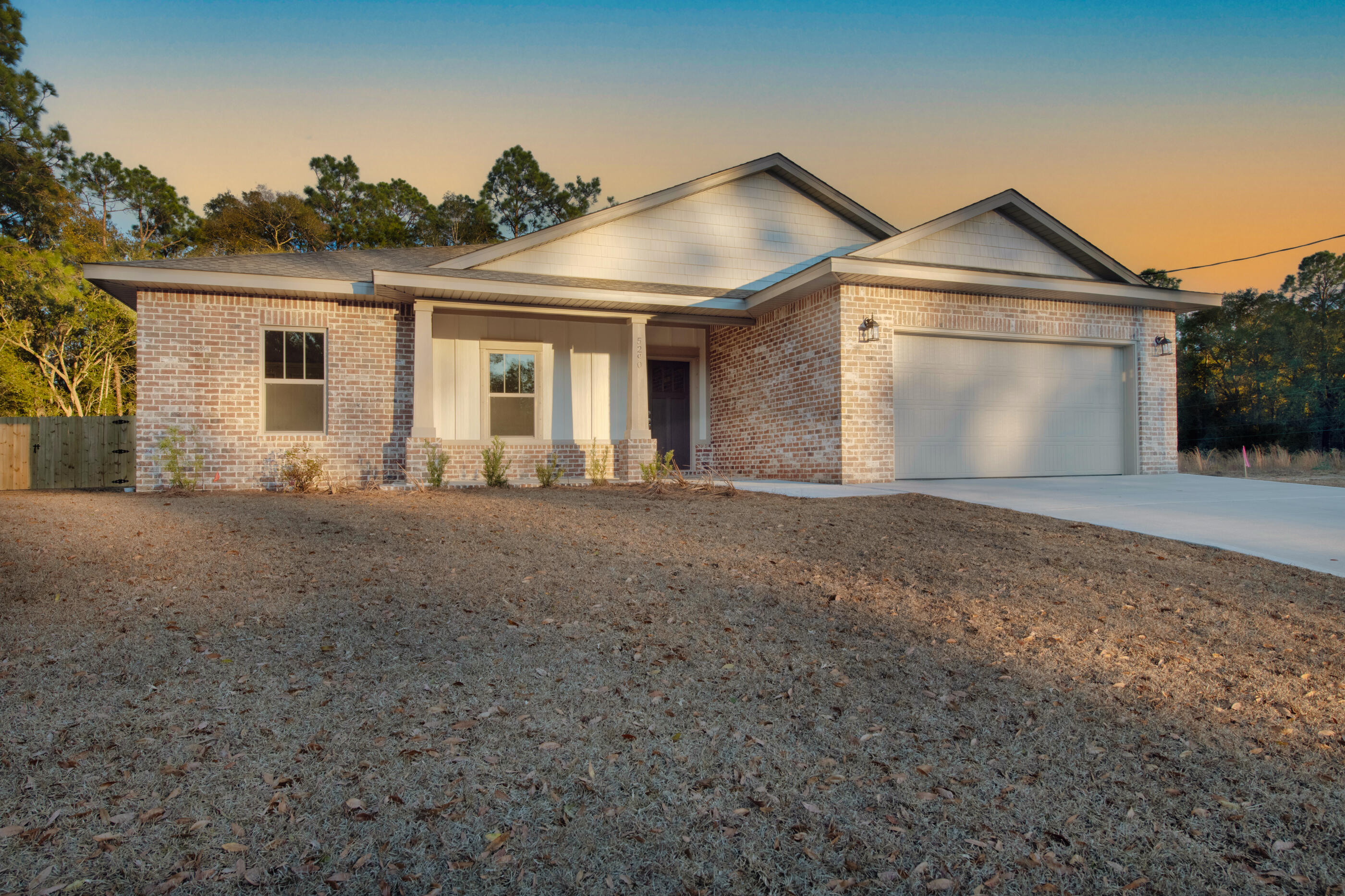 This exceptional new home features many upgrades throughout. Clad with the timeless durability of brick, cement fiber board accents, and an architectural shingled roof. Interior offers luxury vinyl plank in the common areas, visually pleasing neutral tile in the baths and laundry room, and carpet in the bedrooms. Custom paint color is accented with a wide baseboard, beautiful crown molding, and spectacular tray ceiling accents in the master bedroom, dining and entry area. Transom windows over the hall entryways provide a high-end custom touch. Stainless steel appliances including refrigerator, stunning shaker style cabinets, and granite throughout finish the home exquisitely.
