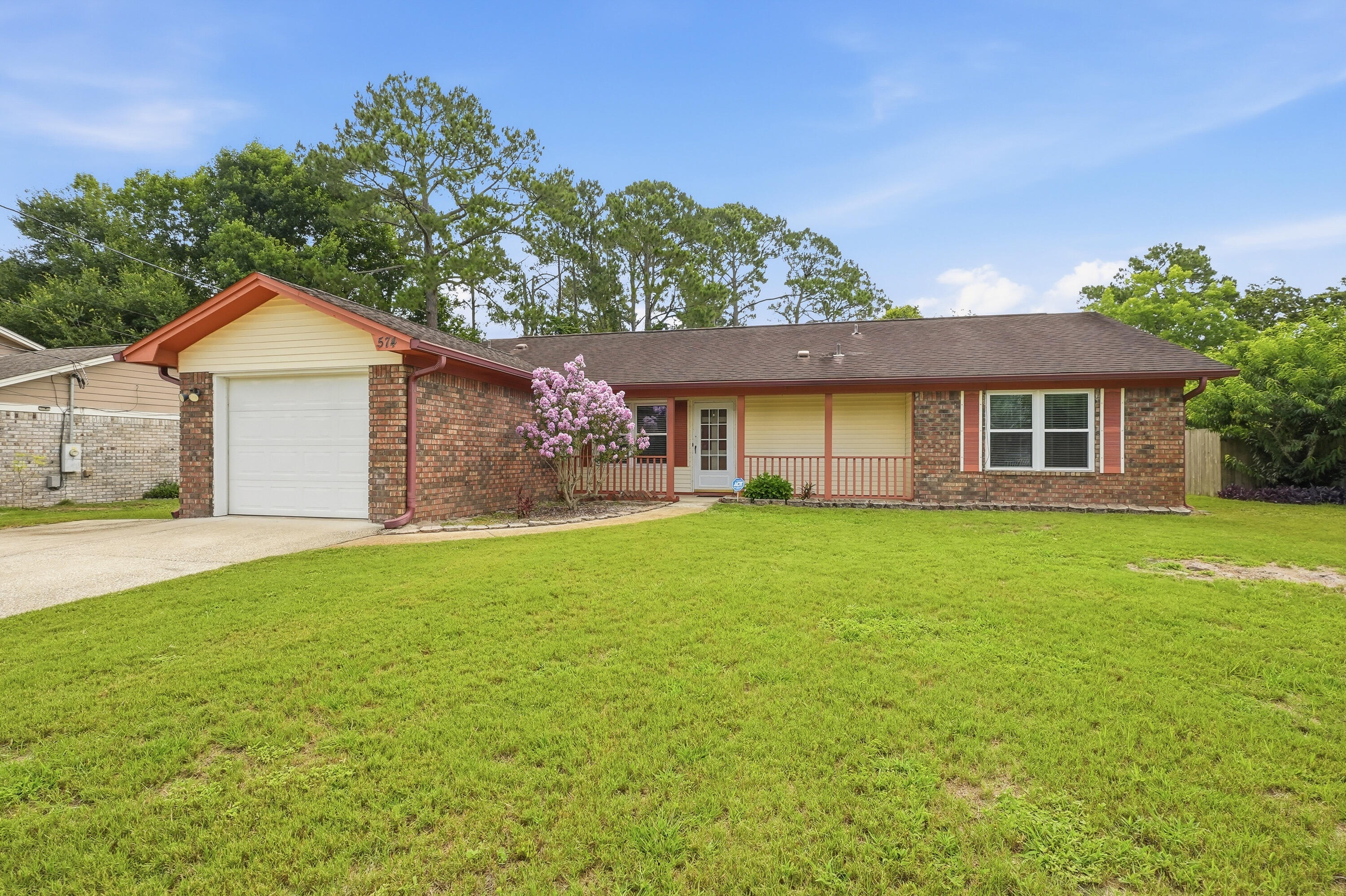 Welcome to 574 Peppertree Lane! New ROOF prior to closing. This 3-bedroom, 2-bath home offers comfortable living with multiple flexible spaces and plenty of room to enjoy from day one. A charming wood-burning fireplace serves as the focal point of the first living area, creating a warm and inviting atmosphere.
The kitchen features granite countertops, ample cabinet space, and a functional layout that flows into the home's living and dining area. This property is move-in ready and offers an excellent opportunity to personalize over time. In addition to the separate dining area, two flex rooms off the main living space provide endless possibilities for a home office, playroom, hobby room, or additional sitting area.
The primary suite includes two closets, a linen closet, and a private bathroom with a walk-in shower. Two additional bedrooms offer comfortable accommodations, while tile and LVP flooring run throughout the main living areas, with carpet in the bedrooms. A one-car garage provides additional storage and parking convenience.
Outside, you'll find a large patio area ideal for relaxing or entertaining, along with a utility shed that conveys as-is. Conveniently located near NAS Pensacola, Naval Hospital Pensacola, shopping, dining, and just a short drive to Pensacola Beach and Perdido Key, this home offers the ideal combination of space, flexibility, and location.
